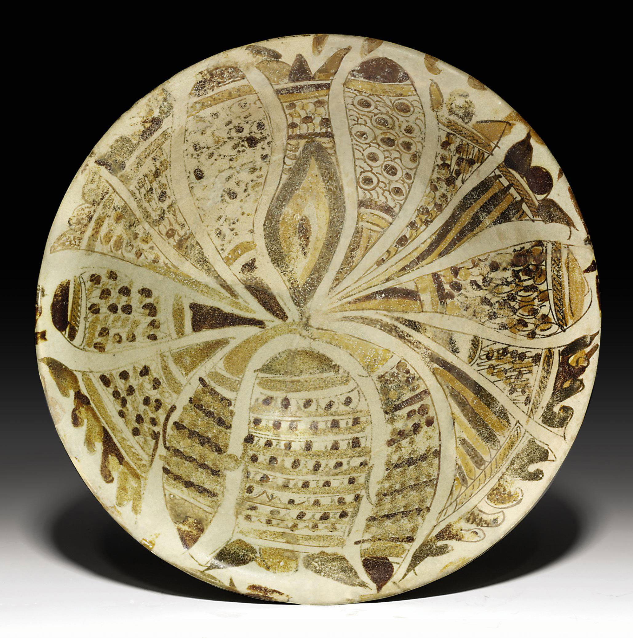 AN ABBASID POLYCHROME LUSTRE POTTERY BOWL , MESOPOTAMIA, 9TH CENTURY