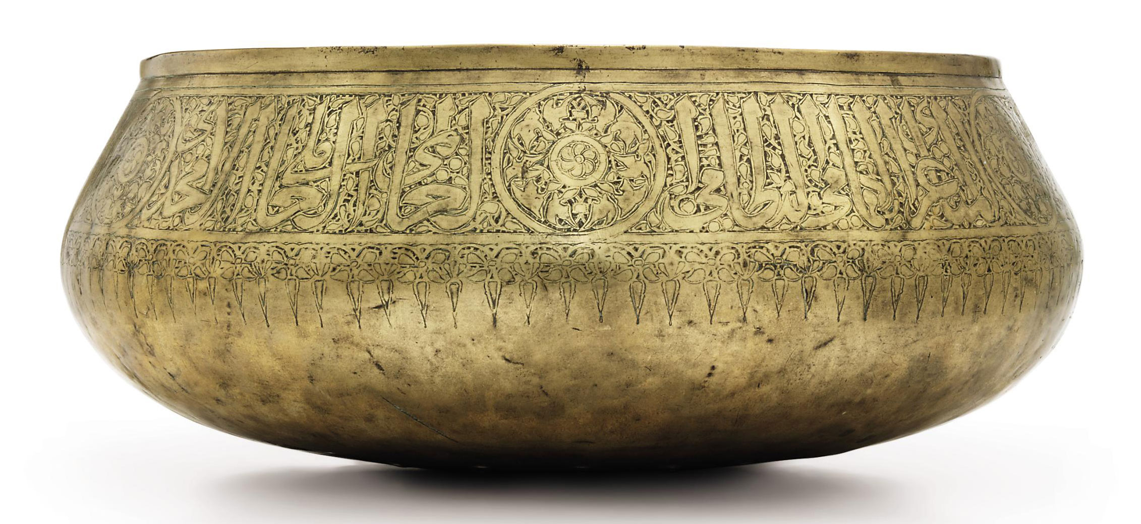 A LARGE MAMLUK BRASS BOWL , EGYPT OR SYRIA, PERIOD OF ALMALIK ALNASIR