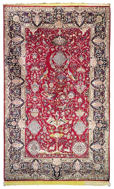 A SILK KASHAN RUG , SIGNED BY DERAKHSHESH, CENTRAL PERSIA, CIRCA 1940