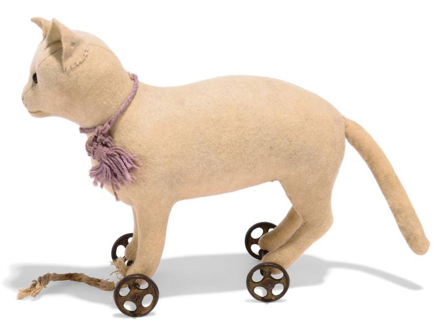 A STEIFF FELT CAT ON WHEELS, (1117), standing, white, black boot button