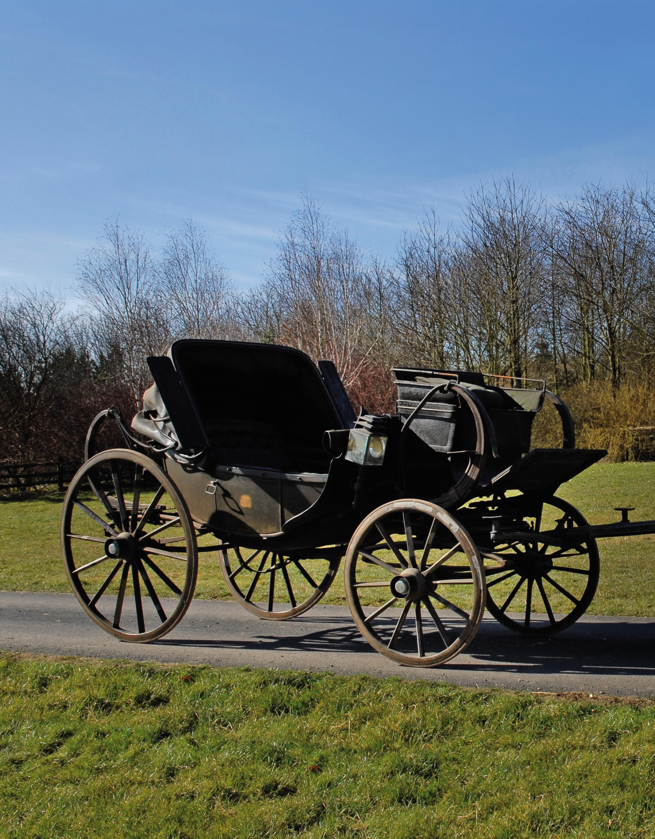 AN IV BLACKJAPANNED AND LIVERYPAINTED CSPRING PARK BAROUCHE