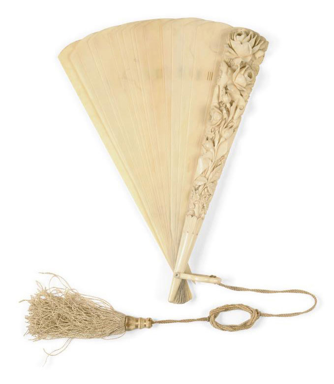 A CARVED IVORY PARASOL HANDLE AND A CARVED IVORY BRISÉ FAN , FRENCH