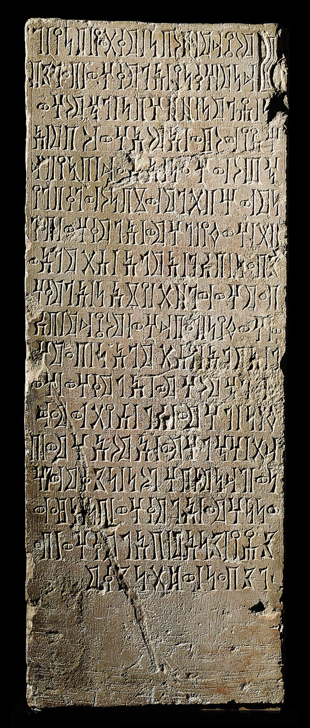 A SOUTH ARABIAN LIMESTONE INSCRIBED PILLAR STELE CIRCA 1ST CENTURY A
