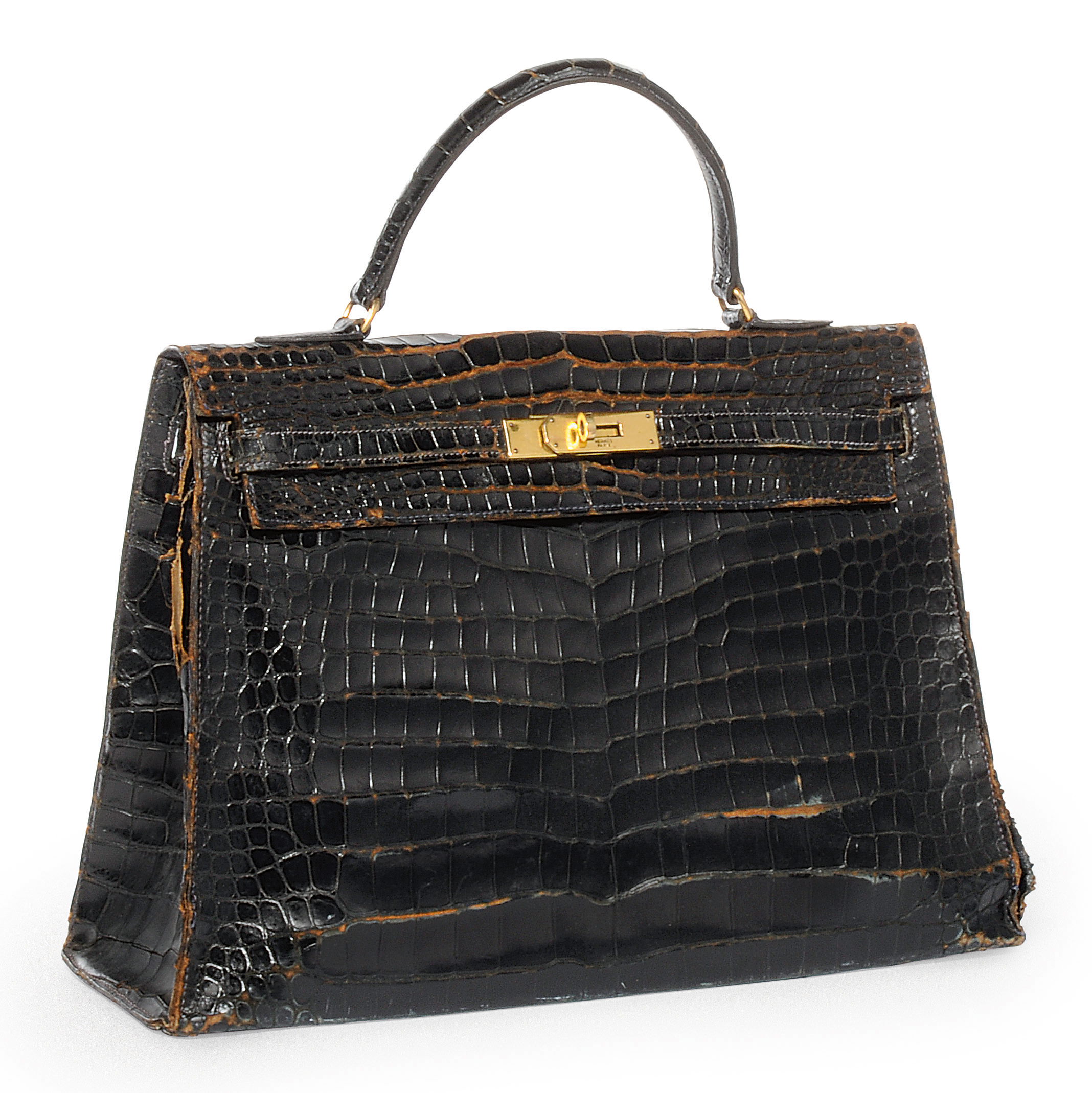 A NOIR CROCODILE 'KELLY' BAG , HERMÈS, CIRCA 1940 Christie's