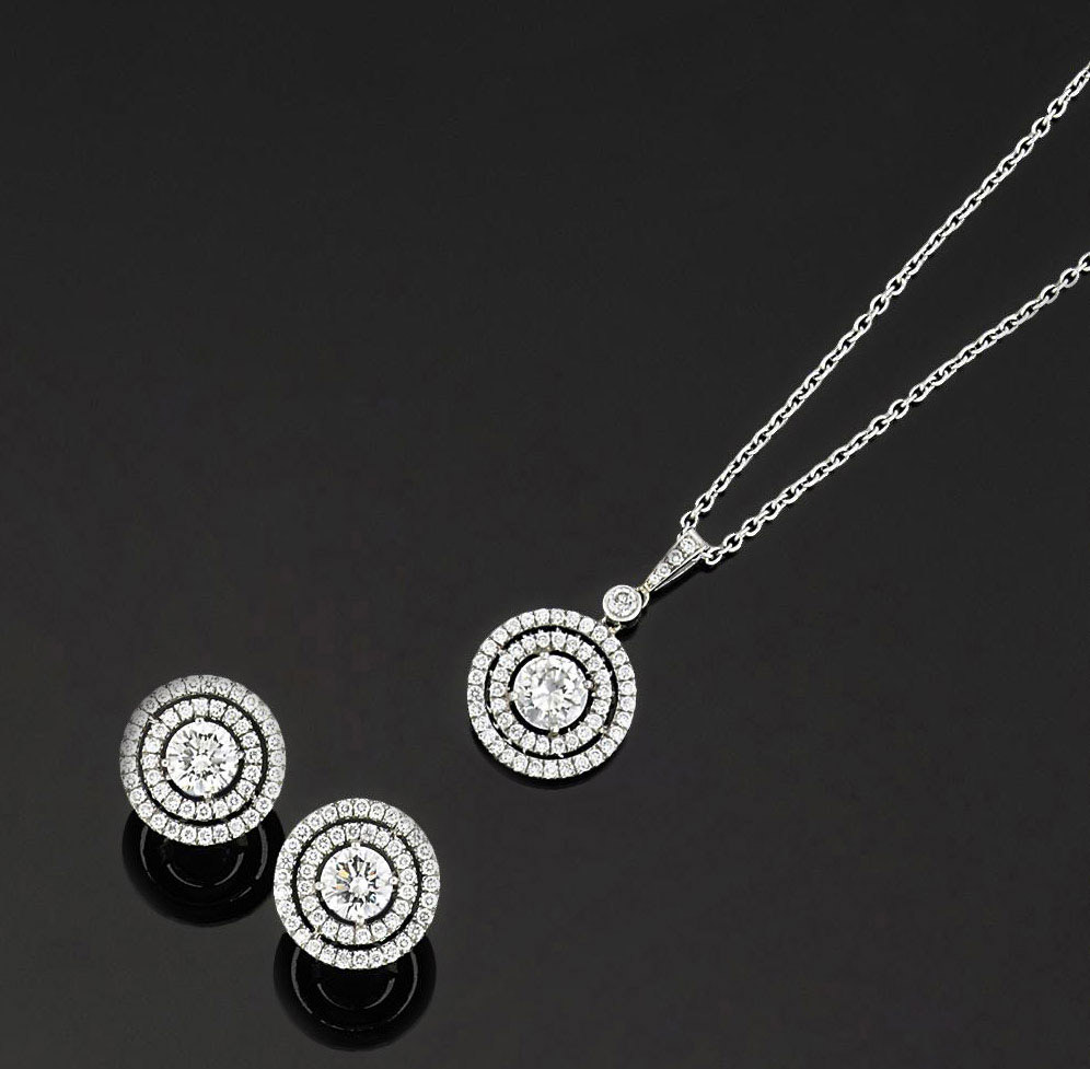 A pair of diamond earrings and a pendant necklace | Christie's