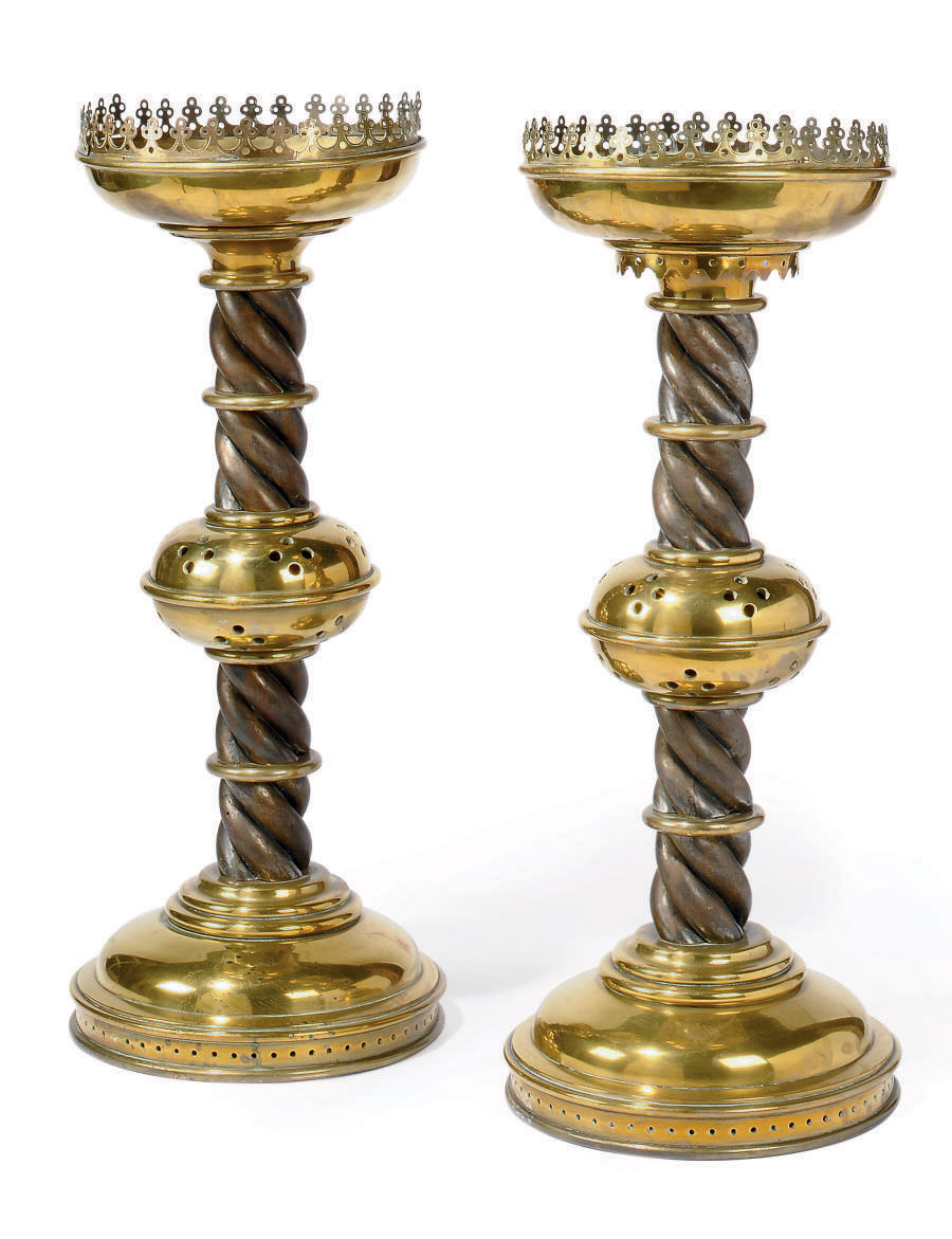 A PAIR OF VICTORIAN BRASS AND STEEL ALTAR CANDLE STANDS , CIRCA 1880 Christie's