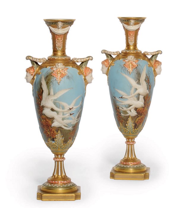 A PAIR OF ROYAL WORCESTER TWOHANDLED VASES