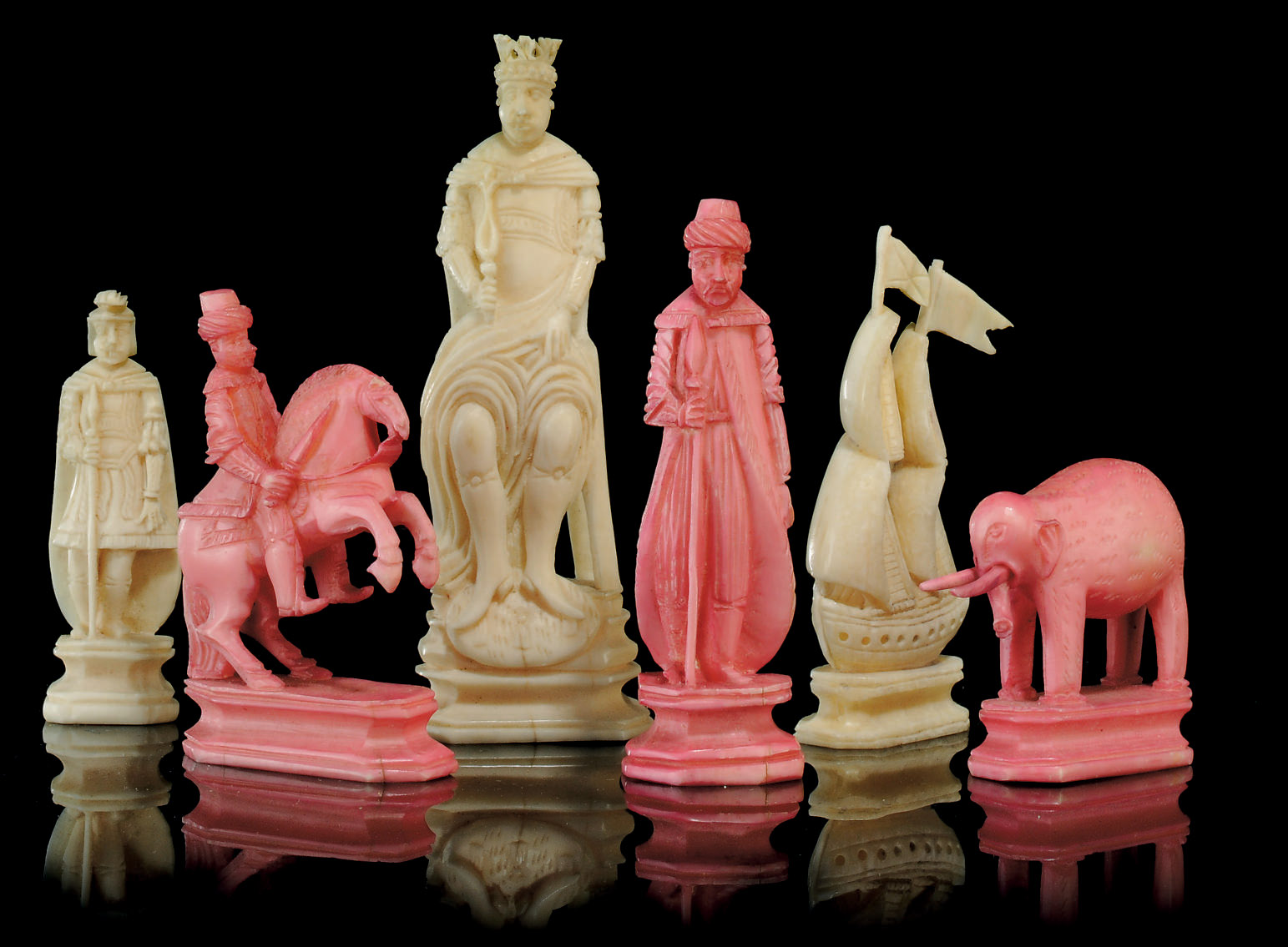 A RUSSIAN CARVED WALRUS IVORY FIGURAL CHESS SET , KHOLMOGORY, 19TH