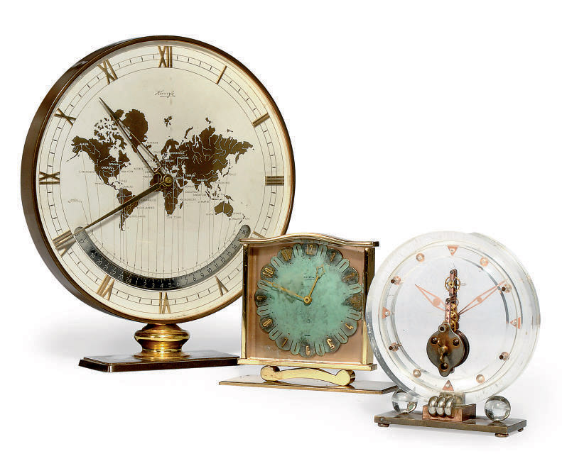 A GERMAN PATINATED BRASS WORLD TIME DESK CLOCK AND TWO DESK TIMEPIECES