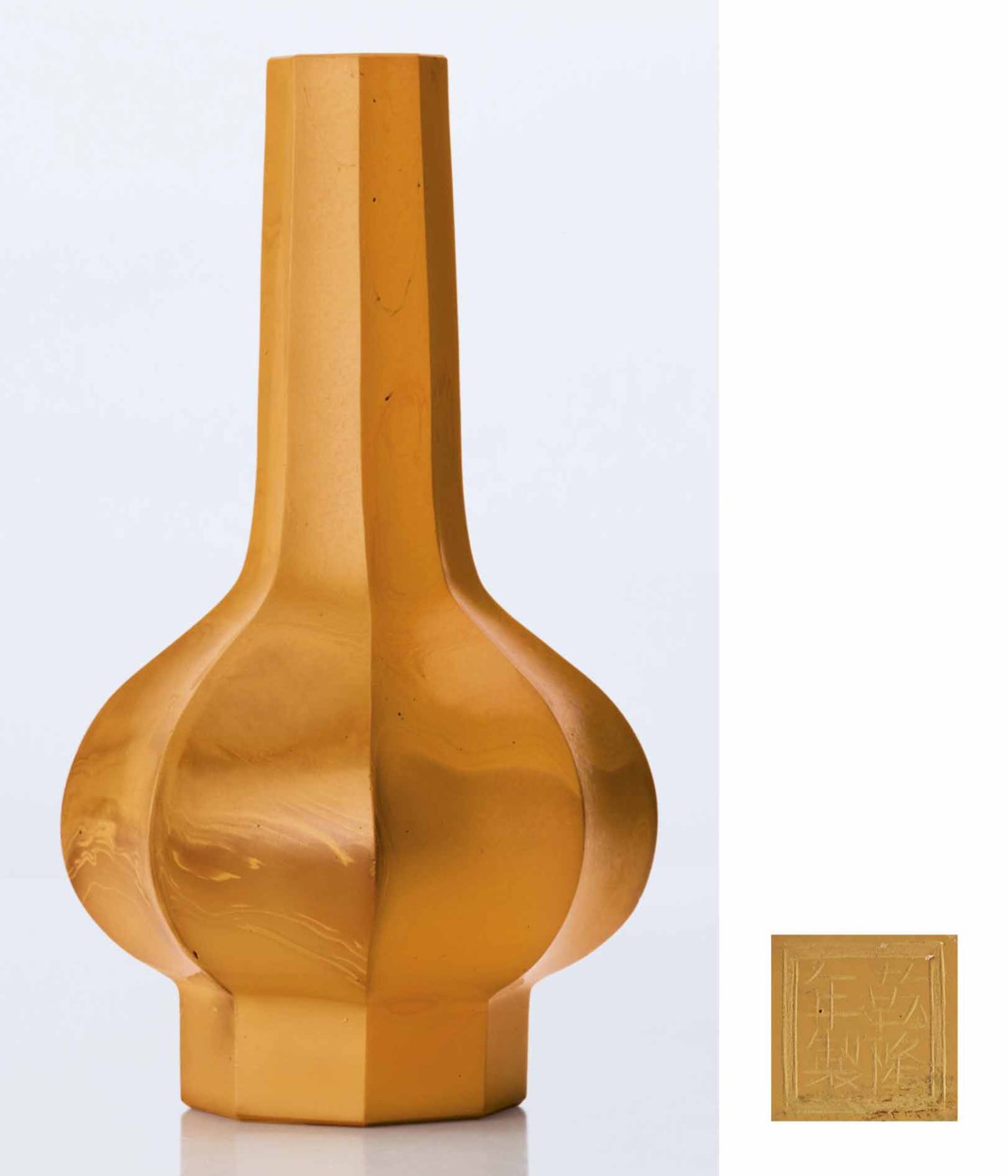 A RARE IMPERIAL OPAQUE MOTTLED ORANGE GLASS FACETTED BOTTLE VASE