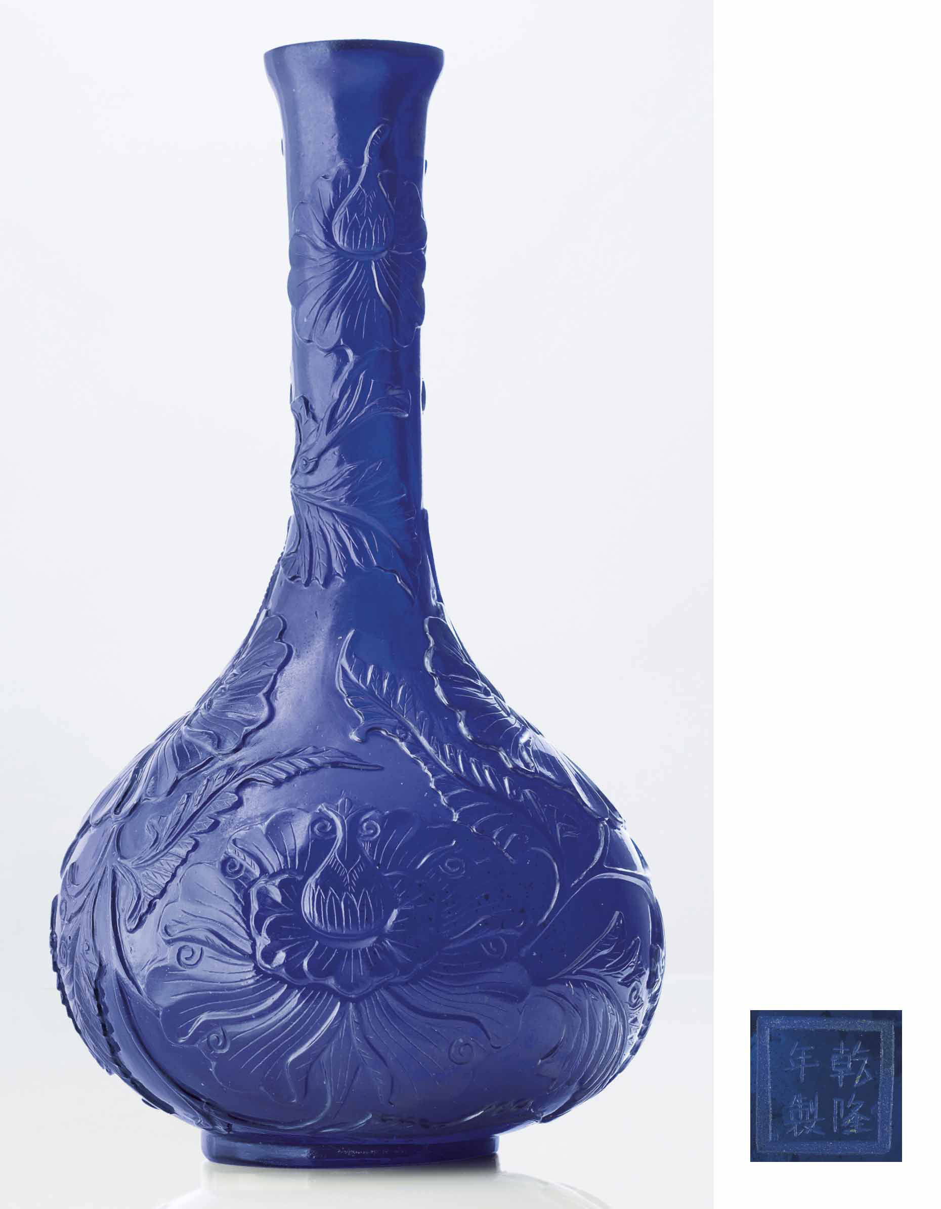 A RARE IMPERIAL CARVED TRANSPARENT COBALTBLUE GLASS BOTTLE VASE , QIANLONG ENGRAVED FOUR