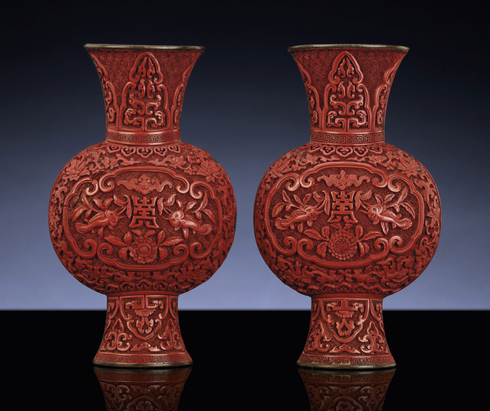 A RARE PAIR OF CARVED CINNABAR LACQUER WALL VASES , QING DYNASTY, 18TH