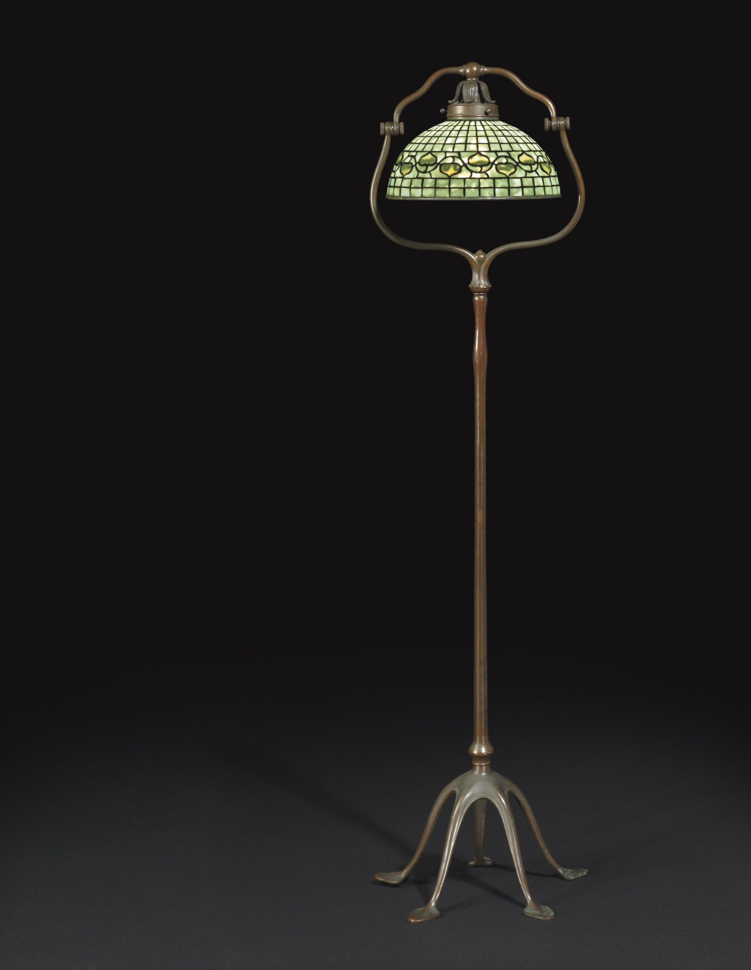 TIFFANY STUDIOS , A 'LEAF AND VINE' LEADED GLASS AND BRONZE FLOOR LAMP
