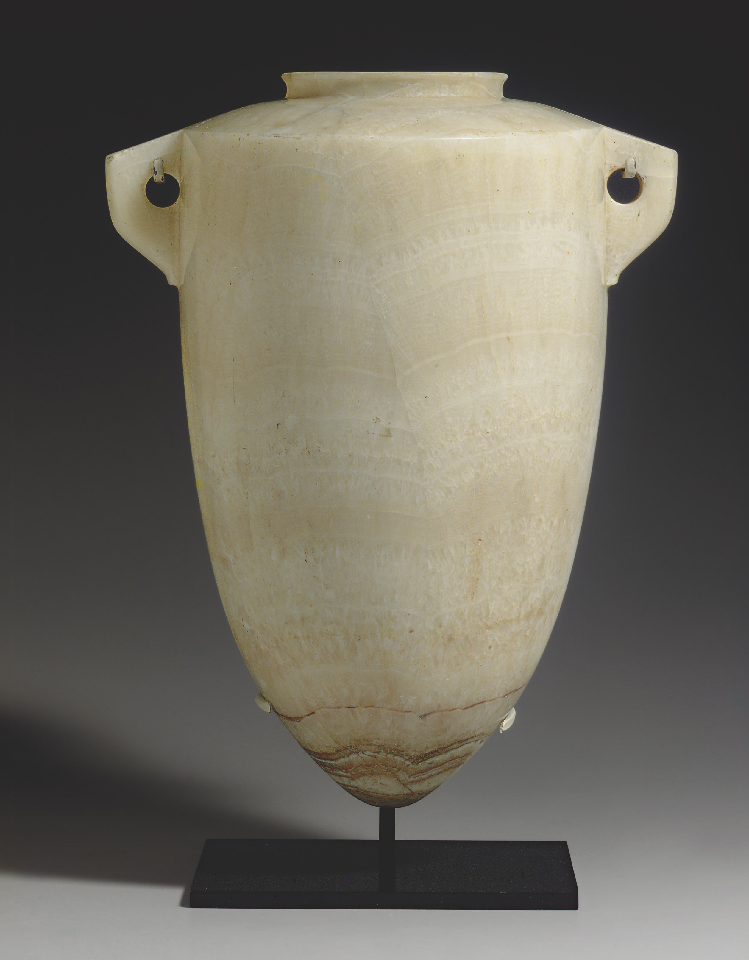 AN EGYPTIAN ALABASTER TORPEDO VASE , THIRD INTERMEDIATE PERIOD, DYNASTY