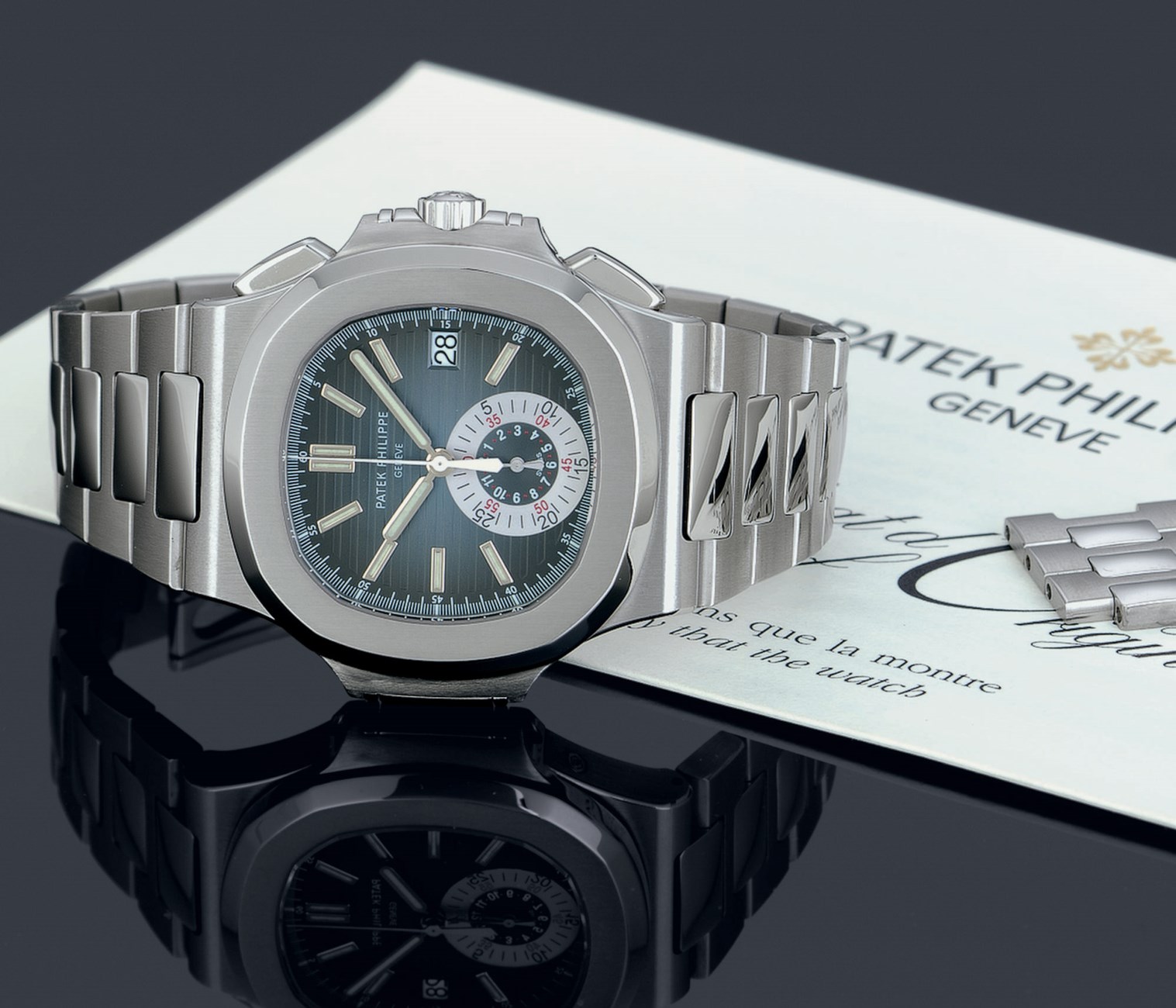 PATEK PHILIPPE. A FINE AND RARE STAINLESS STEEL AUTOMATIC CHRONOGRAPH ...