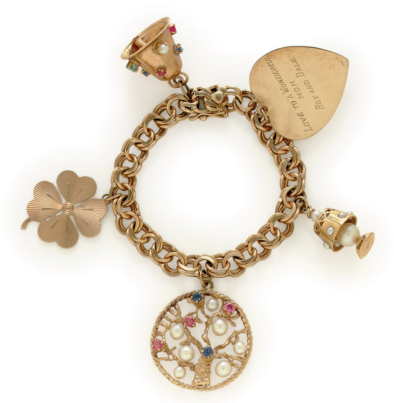 A GOLD CHARM BRACELET | Christie's