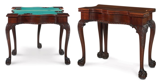 A CHIPPENDALE CARVED MAHOGANY FIVE LEG CARD TABLE