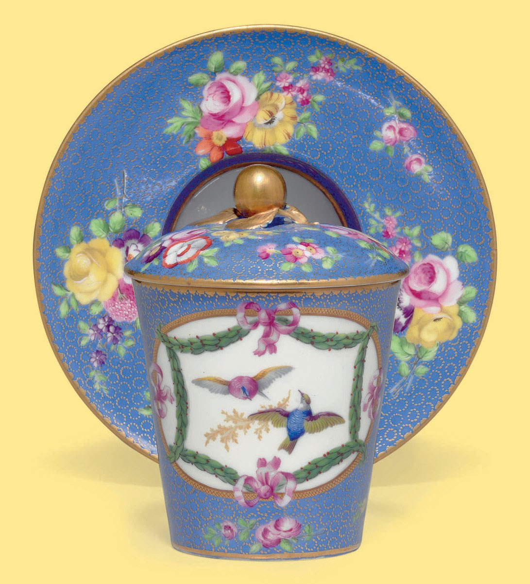 A SEVRES PORCELAIN LATERDECORATED CUP, COVER AND SOCKETED SAUCER