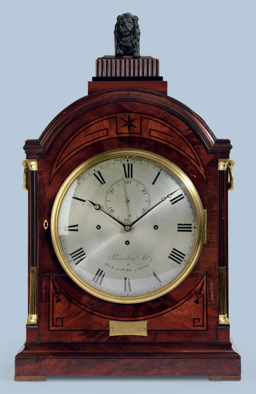 A REGENCY BRONZE AND BRASSMOUNTED AND EBONYINLAID QUARTERCHIMING TABLE CLOCK