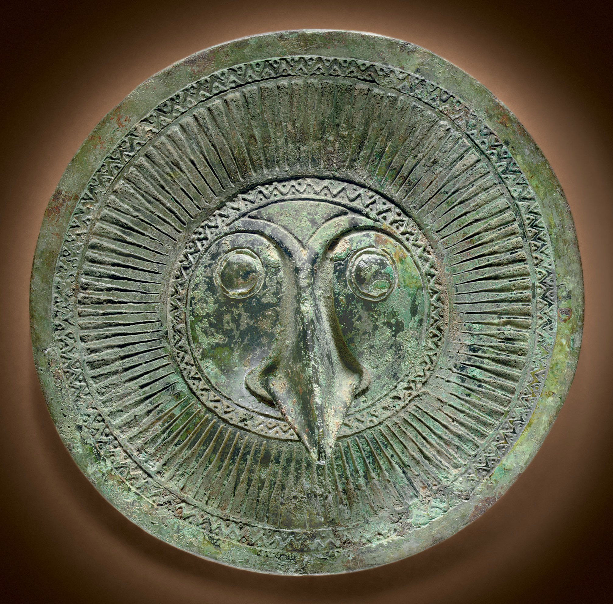 A RARE BRONZE ZOOMORPHIC CIRCULAR FITTING , HAN DYNASTY