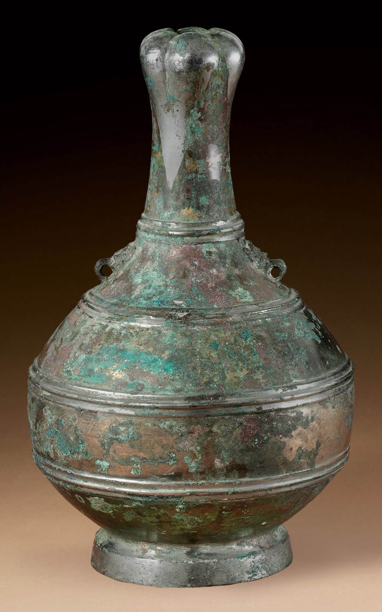 A SILVERDECORATED BRONZE BOTTLE, HU