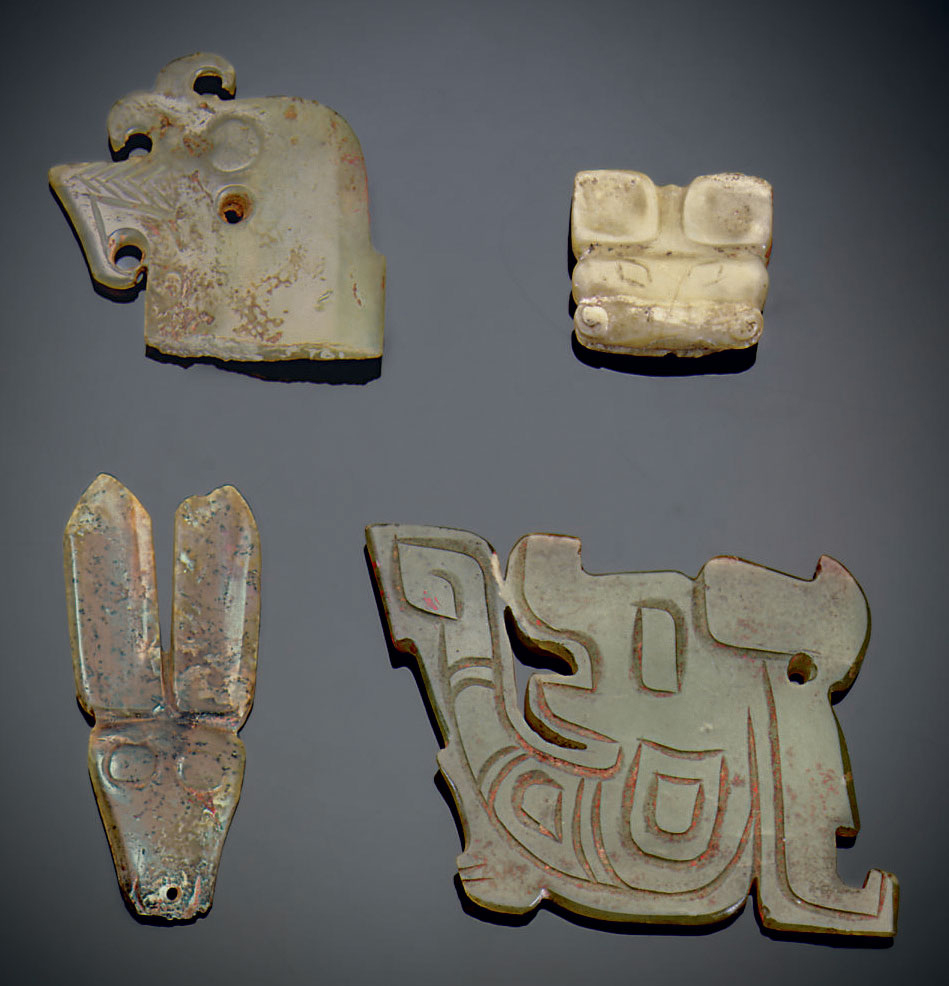 FOUR SMALL JADE ZOOMORPHIC ORNAMENTS , LATE SHANG/EARLY WESTERN ZHOU