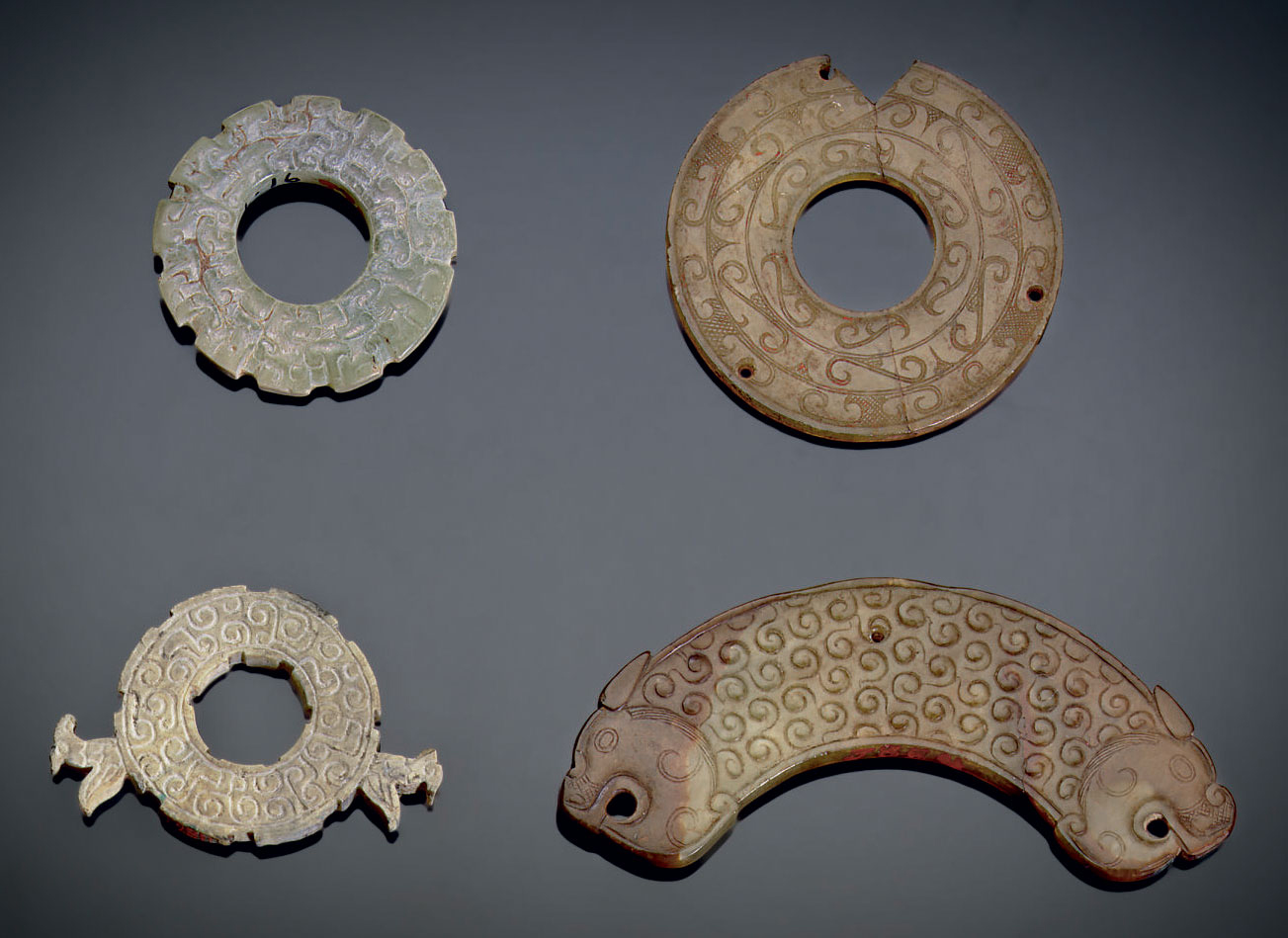 FOUR SMALL JADE ORNAMENTS , EASTERN ZHOU DYNASTY, 6TH3RD CENTURY BC