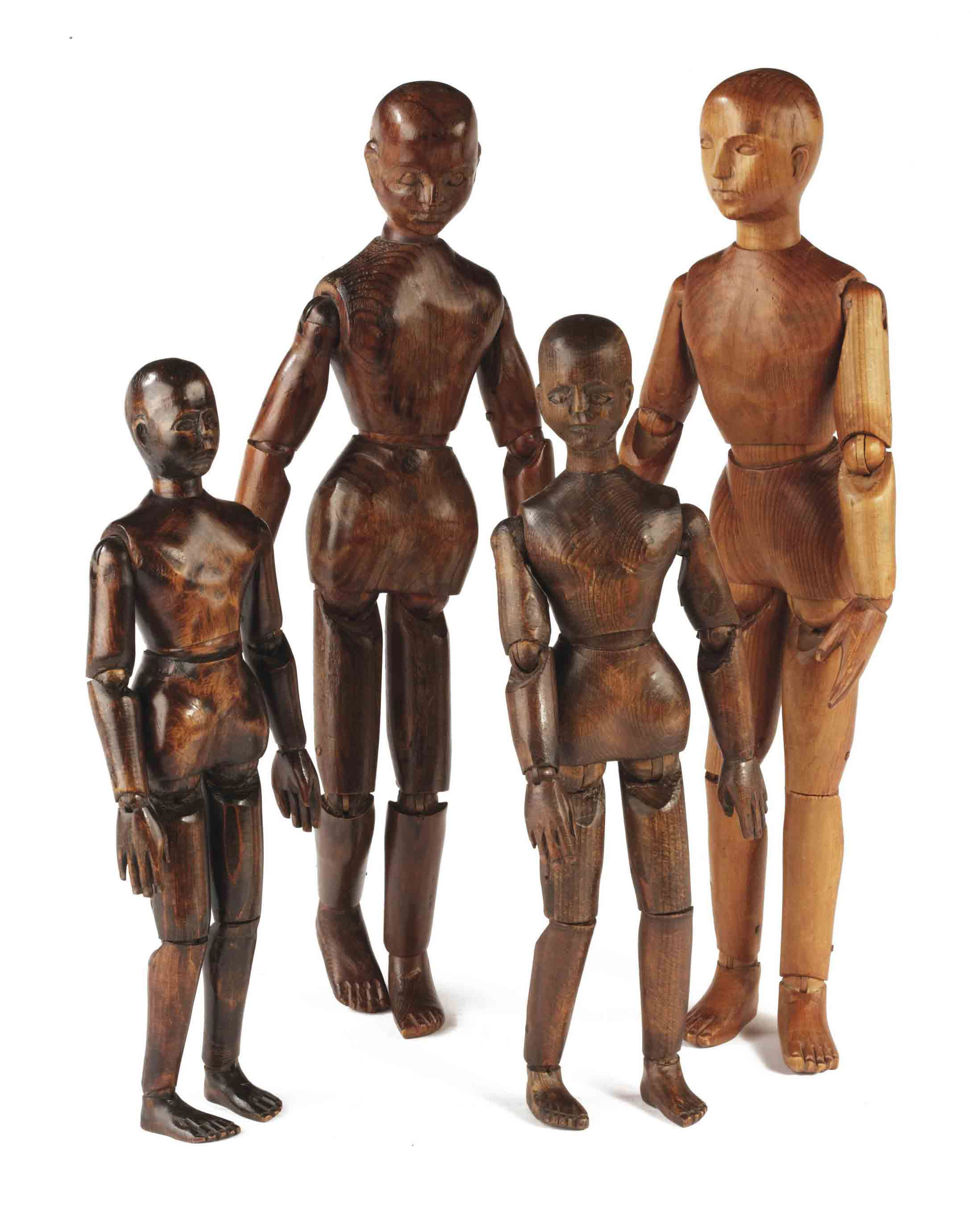 A COLLECTION OF FOUR CARVED PINEWOOD ARTICULATED DOLLS , 19TH CENTURY