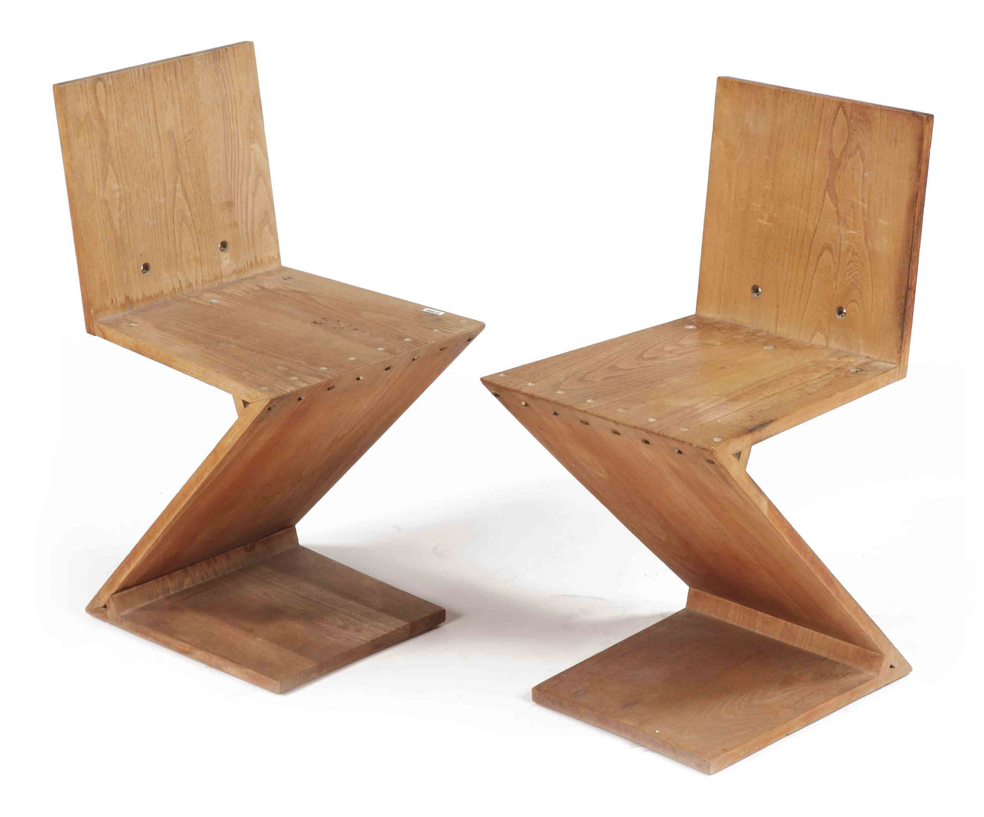 A Pair Of Elmwood Zig Zag Chairs Designed By G Th Rietveld In