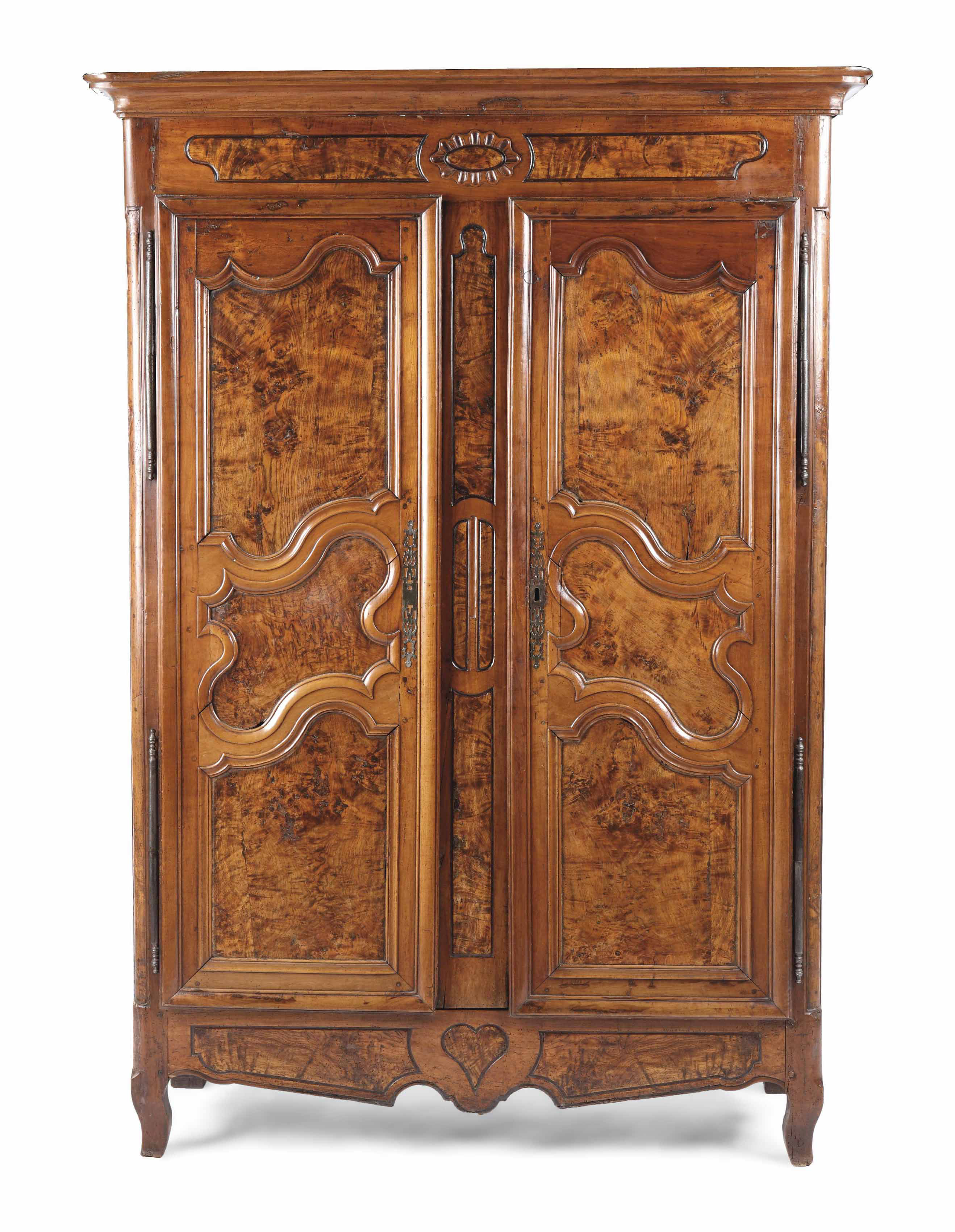 A FRENCH PROVINCIAL STAINED ASH, FRUITWOOD AND OAK CUPBOARD
