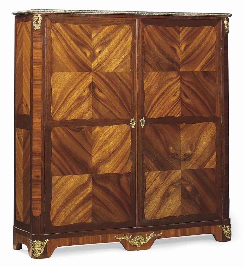 A French Ormolu Mounted Amaranth And Bois Satine Petite Armoire