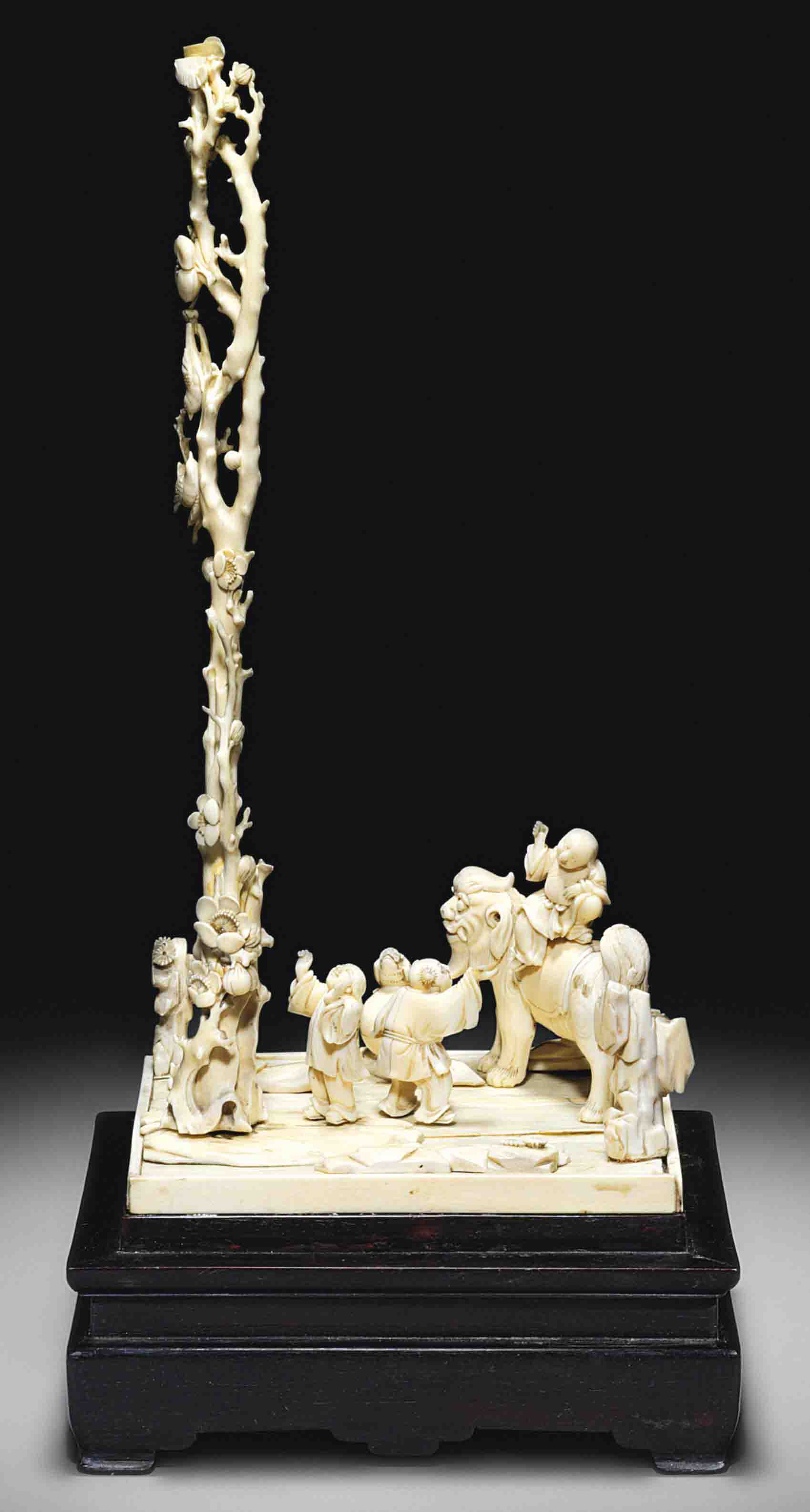 A CARVED STAINED IVORY FIGURE OF SHAN CAI TONGZI , 16TH/17TH CENTURY ...