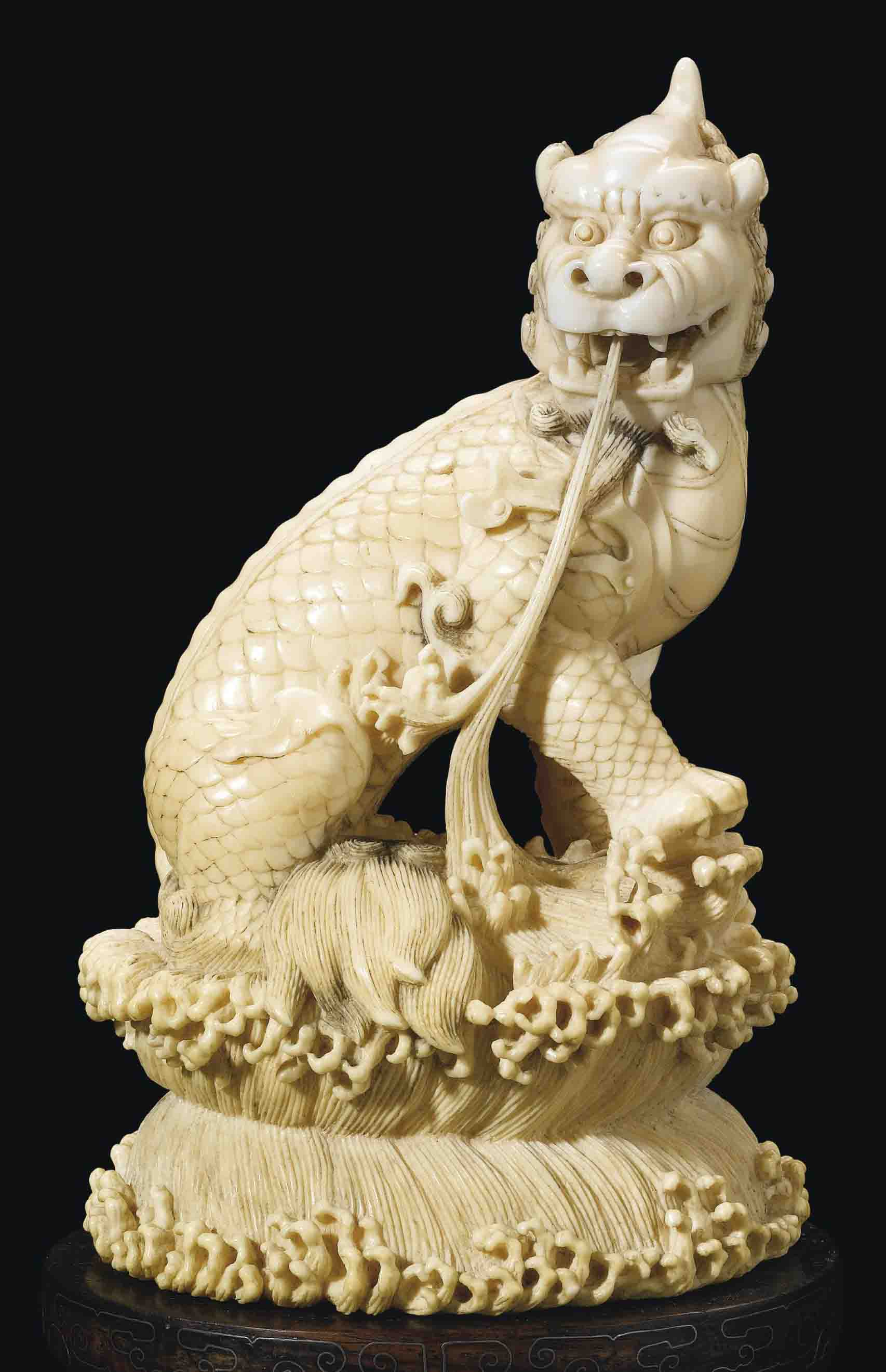 A CARVED IVORY FIGURE OF A QILIN , 19TH CENTURY Christie's