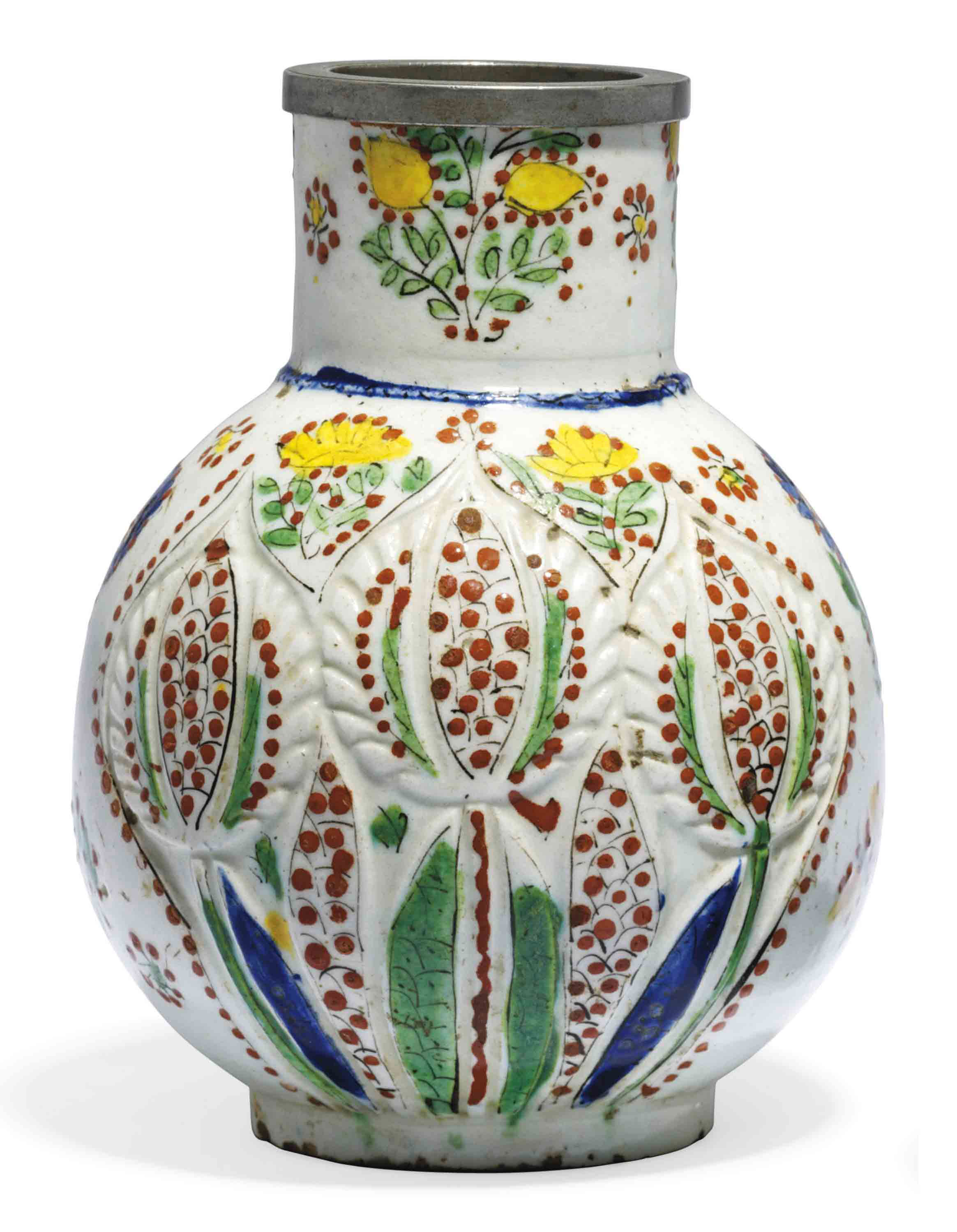 A KUTAHYA MOULDED WHITE POTTERY VASE , OTTOMAN TURKEY, 18TH CENTURY