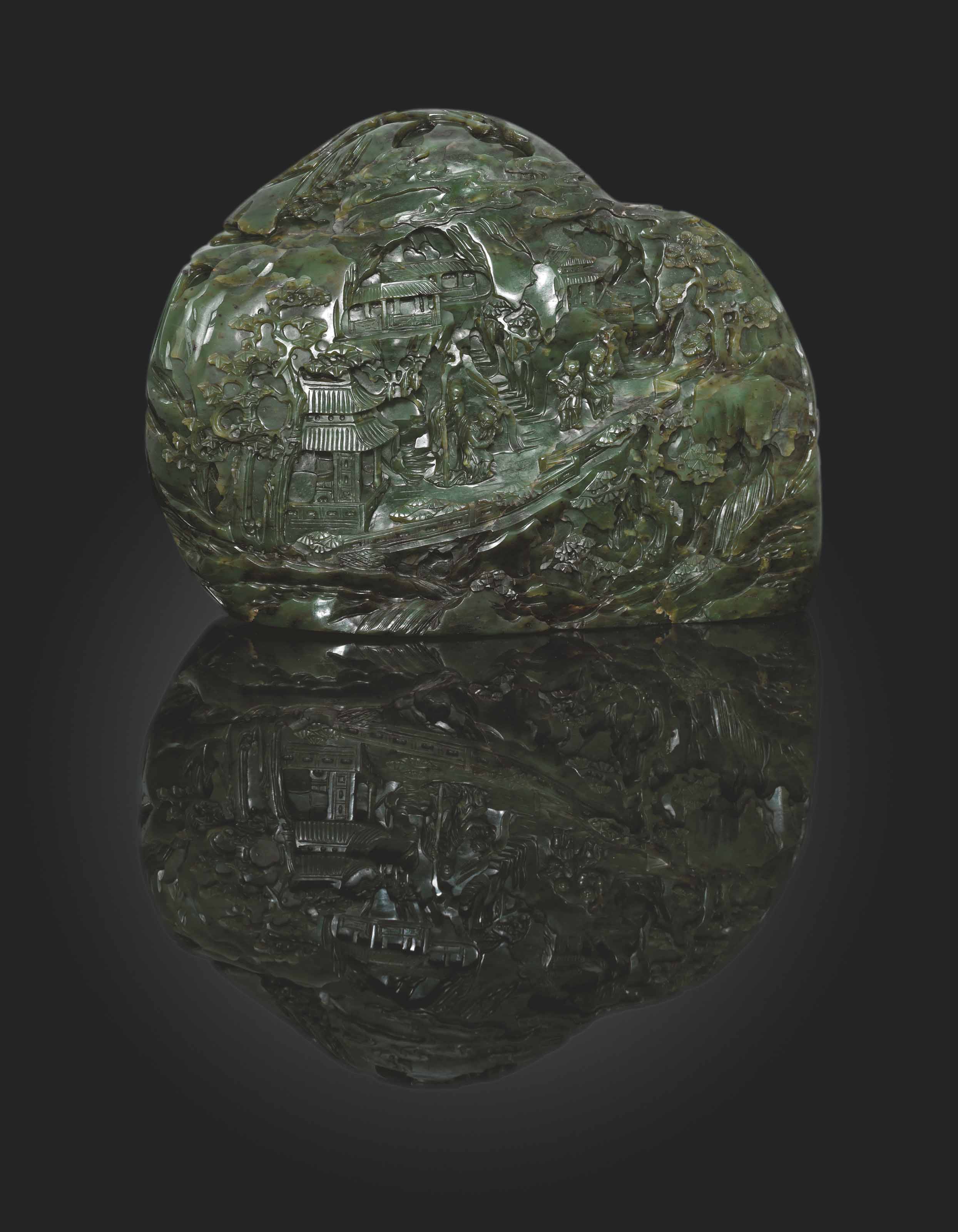 AN IMPRESSIVE LARGE CARVED SPINACHGREEN JADE BOULDER , 18TH CENTURY
