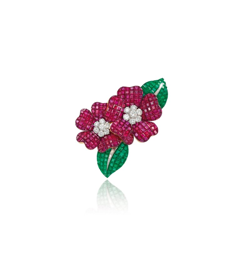 A Mystery Set ruby, emerald and diamond Deux Fleurs clip brooch, by Van Cleef & Arpels. Sold for £235,250 on 29 November 2011  at Christie’s in London