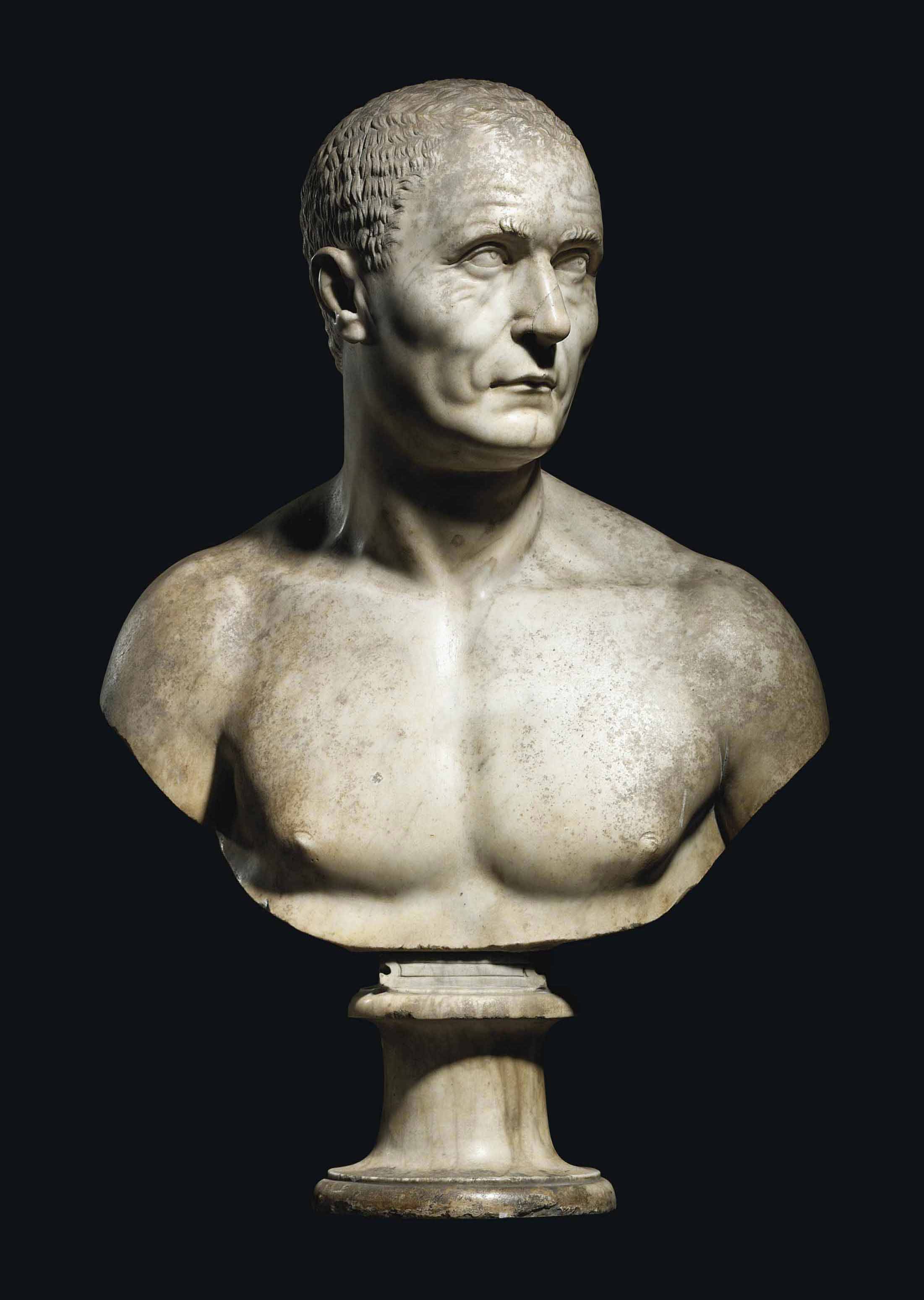 A CARVED MARBLE BUST OF A MAN , AFTER THE ANTIQUE, ITALIAN, POSSIBLY BY
