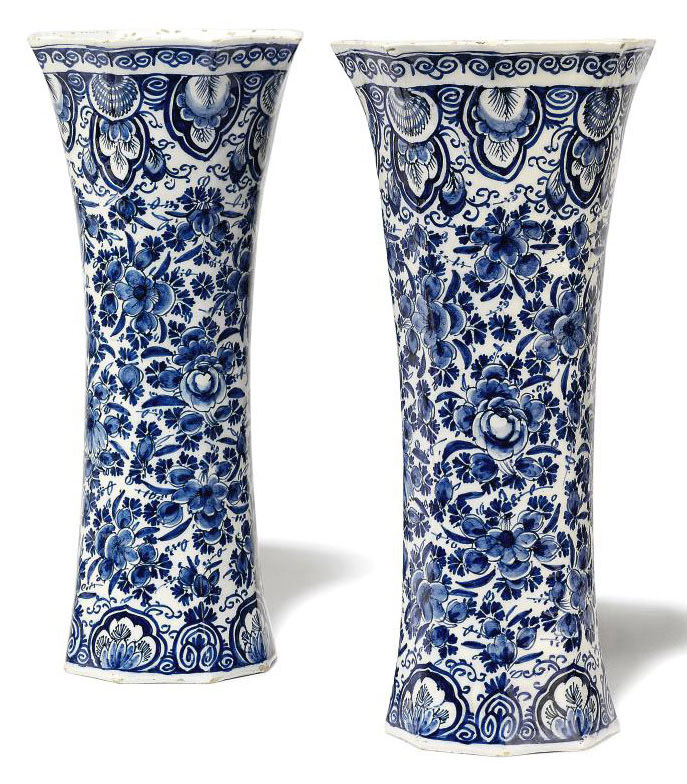 A PAIR OF DUTCH DELFT BLUE AND WHITE FLARED OCTAGONAL SECTION BEAKER