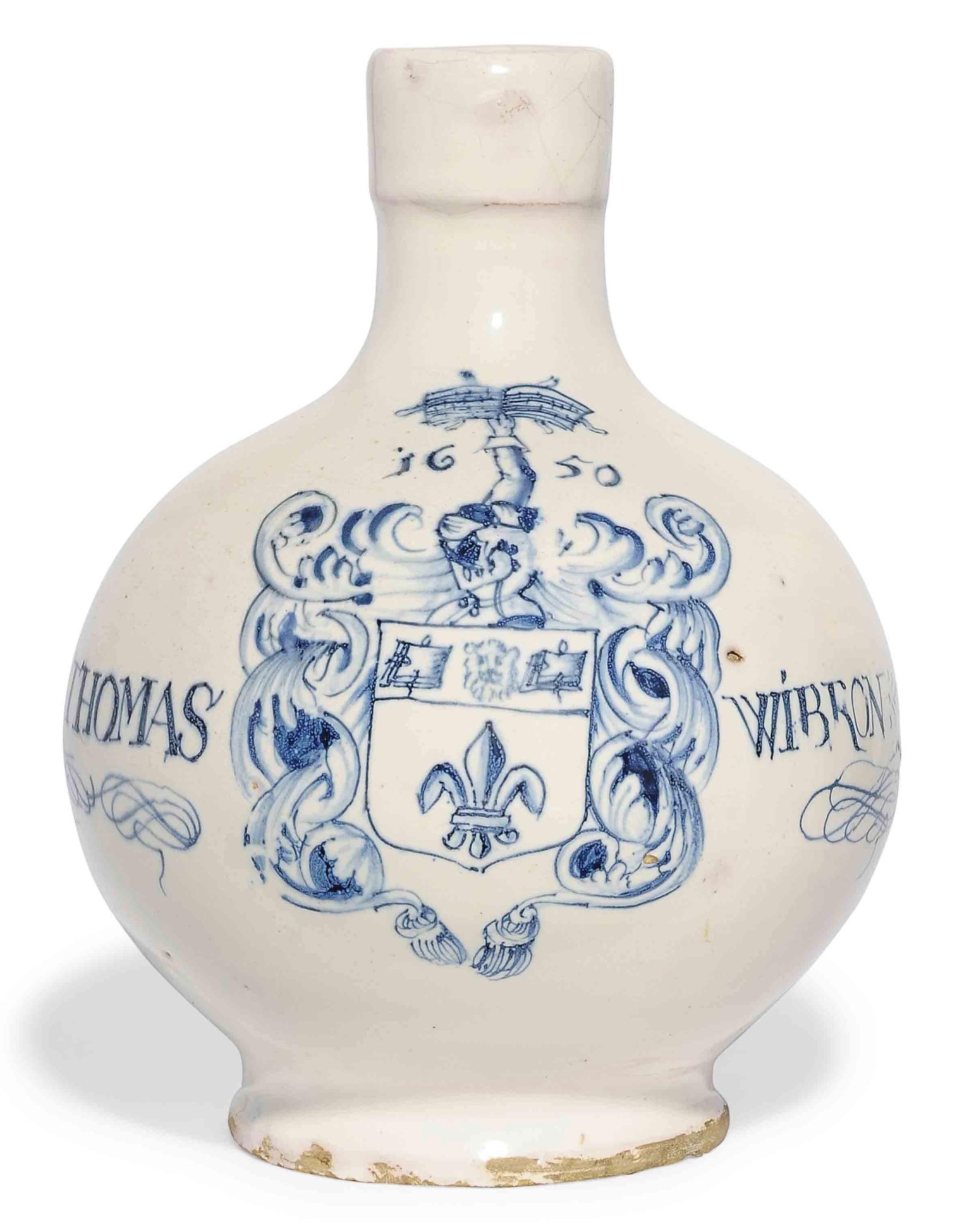 A LONDON DELFT INSCRIBED AND DATED ARMORIAL BLUE AND WHITE WINEBOTTLE