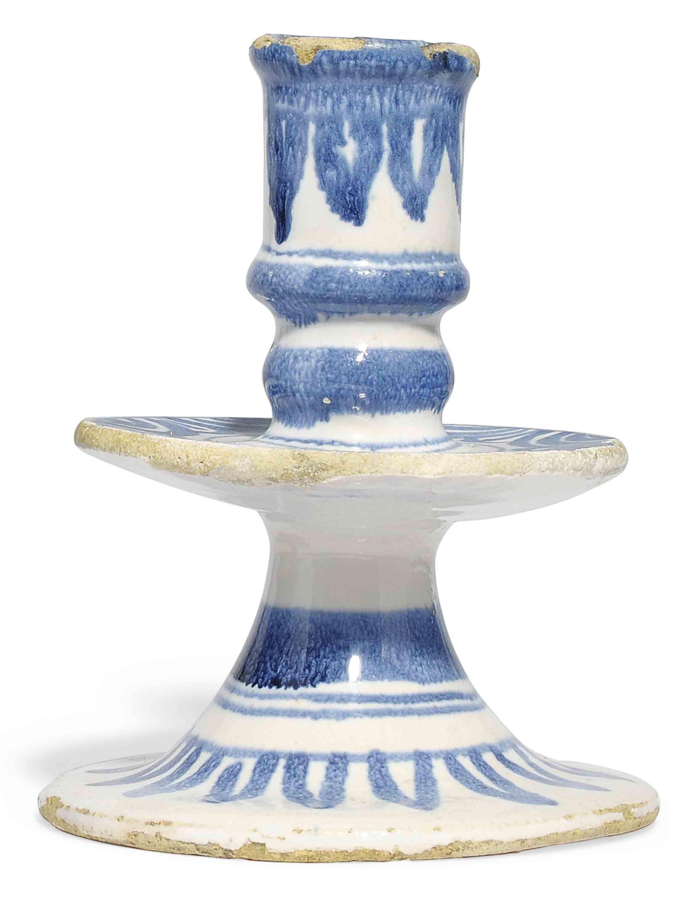 AN ENGLISH DELFT BLUE AND WHITE CANDLESTICK , LATE 17TH CENTURY