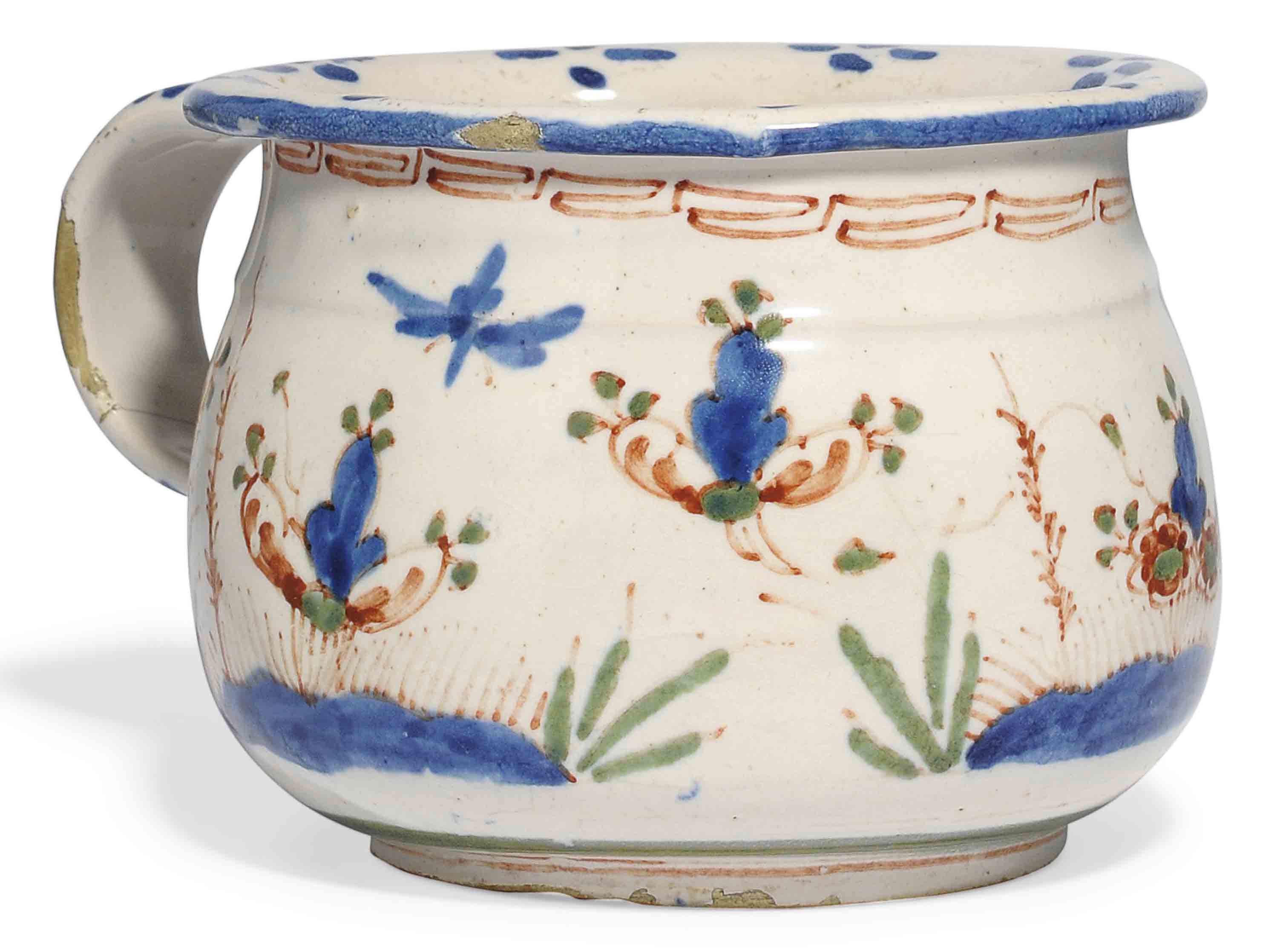 AN ENGLISH DELFT POLYCHROME CHAMBERPOT , SECOND QUARTER OF THE 18TH