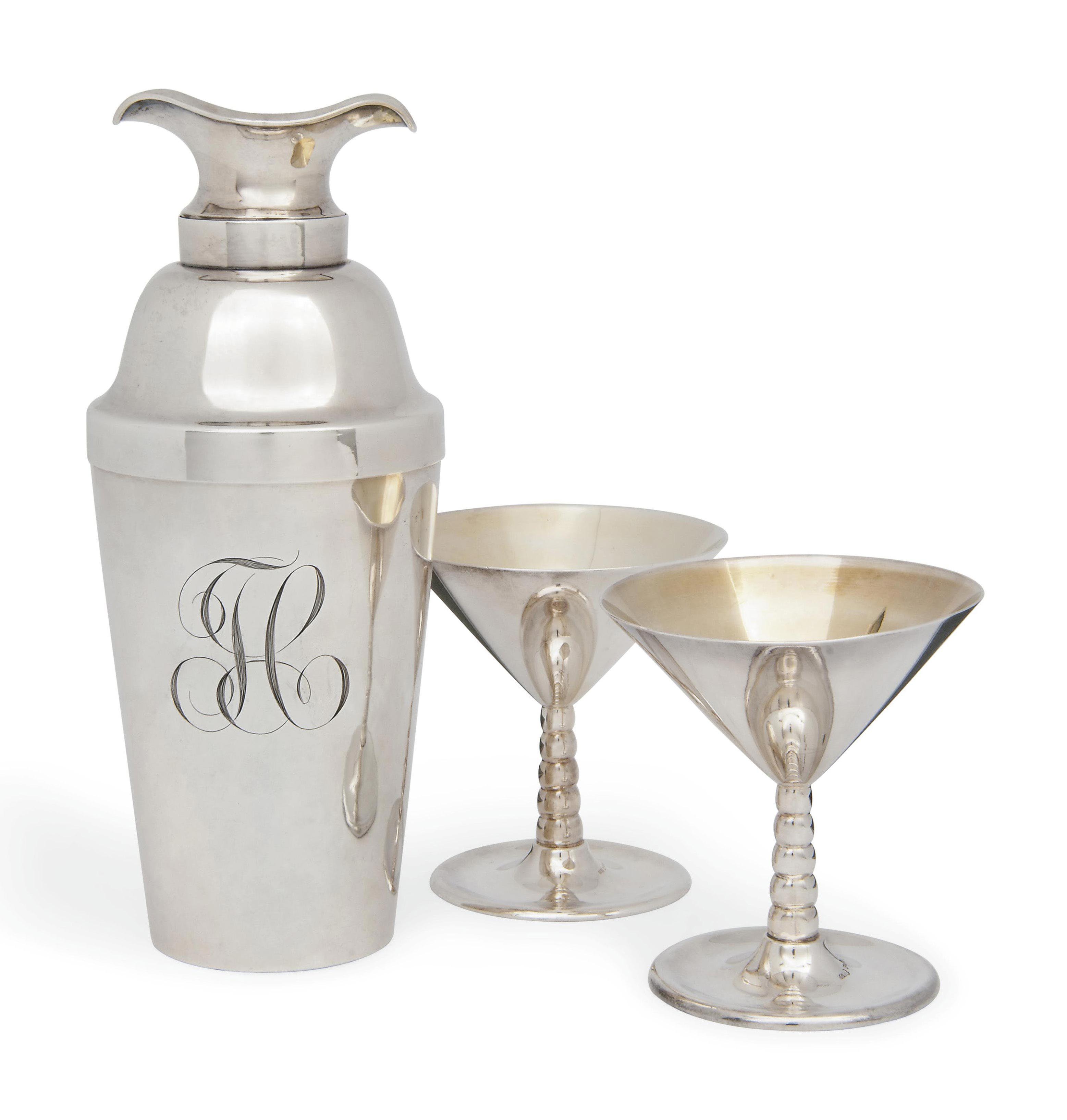 AN AMERICAN SILVER COCKTAIL SHAKER WITH A PAIR OF SWEDISH SILVER