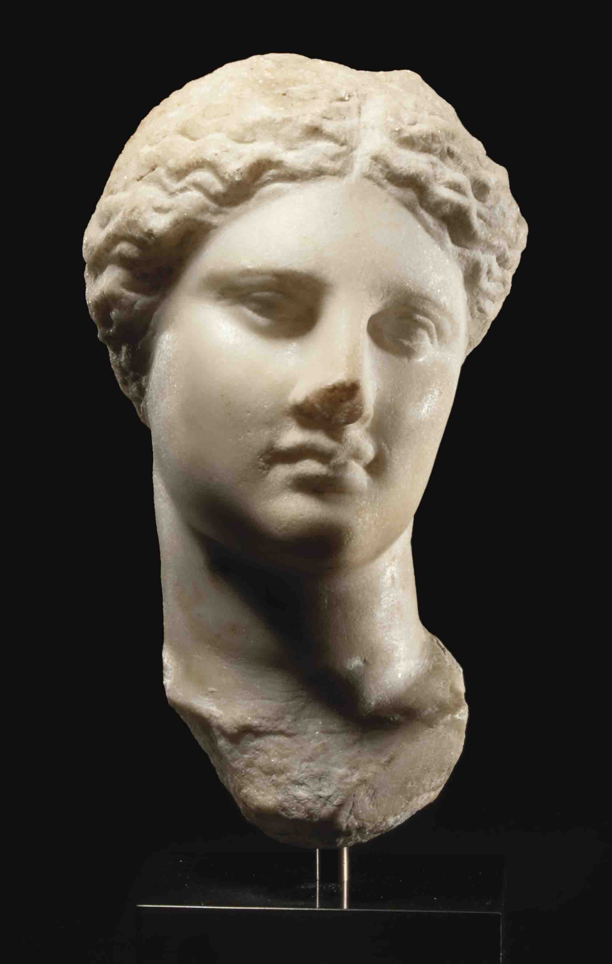 A GREEK MARBLE HEAD OF ISISAPHRODITE , HELLENISTIC PERIOD, CIRCA 3RD