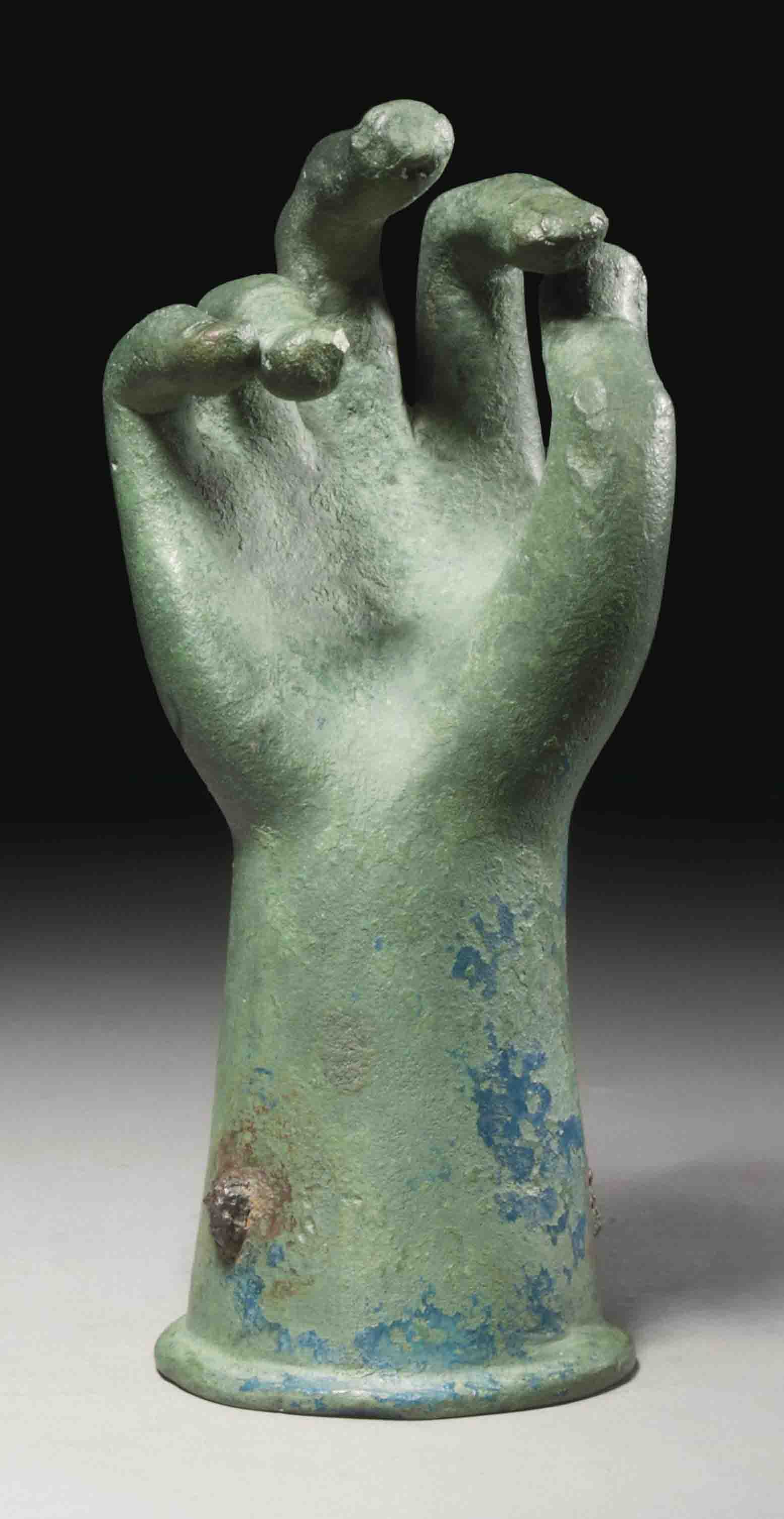 A ROMAN BRONZE VOTIVE RIGHT HAND , CIRCA 1ST2ND CENTURY A.D. Christie's