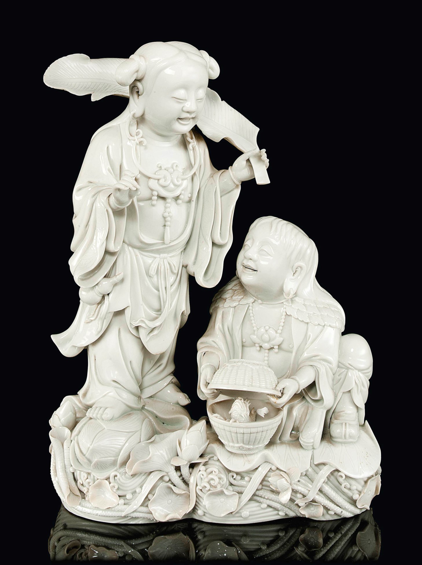 A BLANC DE CHINE FIGURAL GROUP OF HEHE ER XIAN