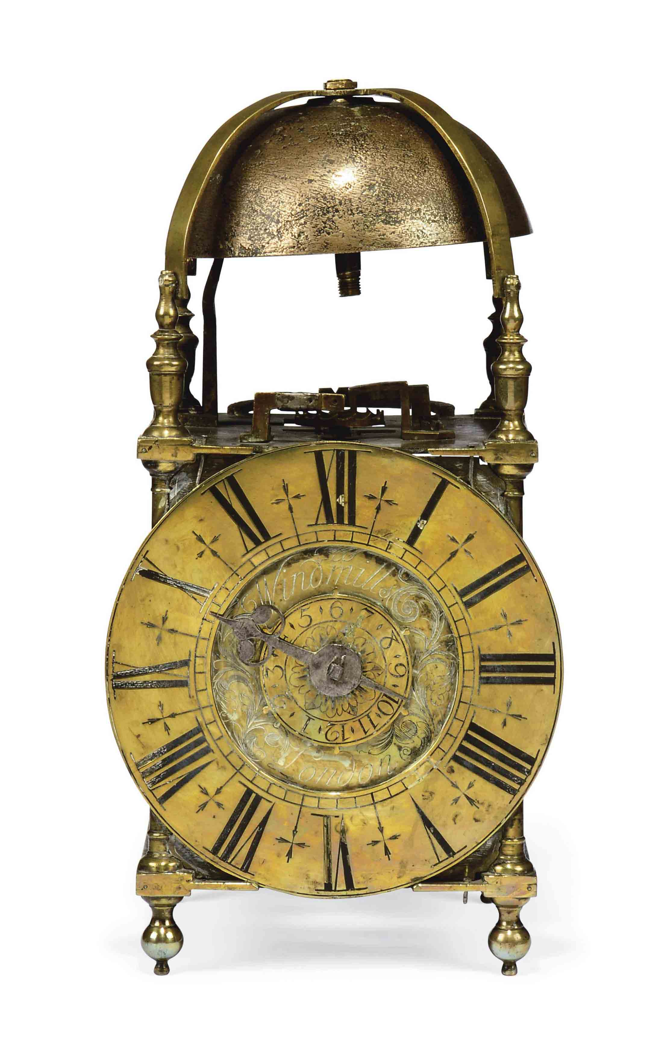 AN ENGLISH BRASS STRIKING LANTERN CLOCK
