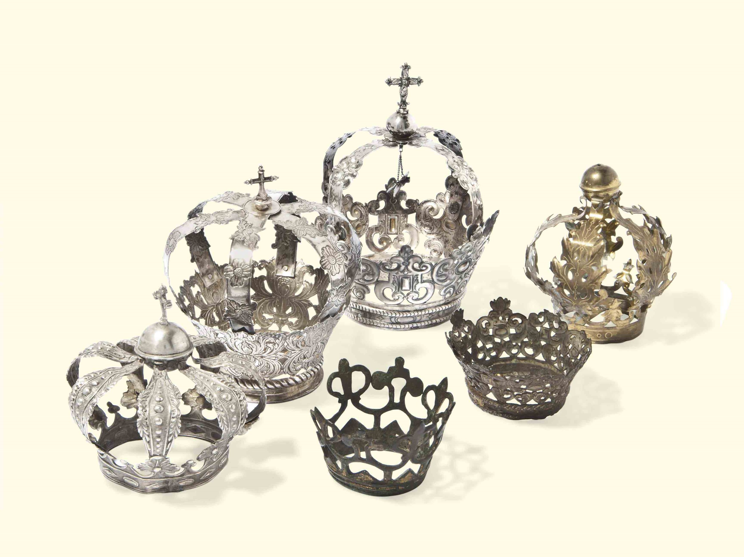 A GROUP OF THREE SPANISH SILVER VOTIVE CROWNS