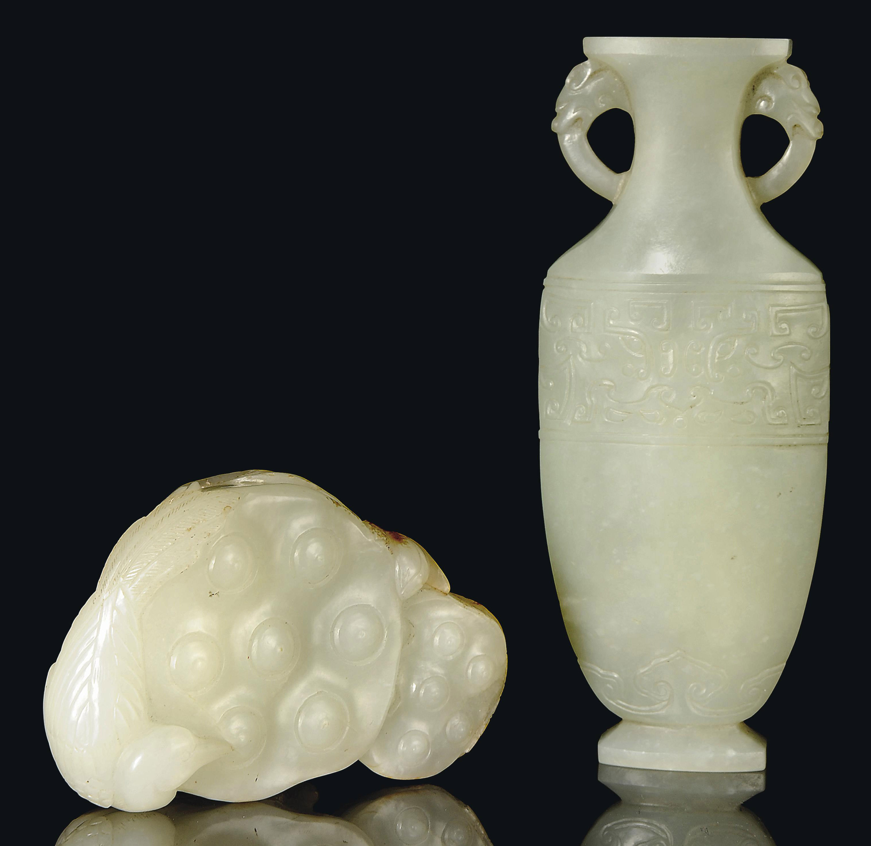A CHINESE JADE CARVING OF A LOTUS POD AND A CHINESE JADE