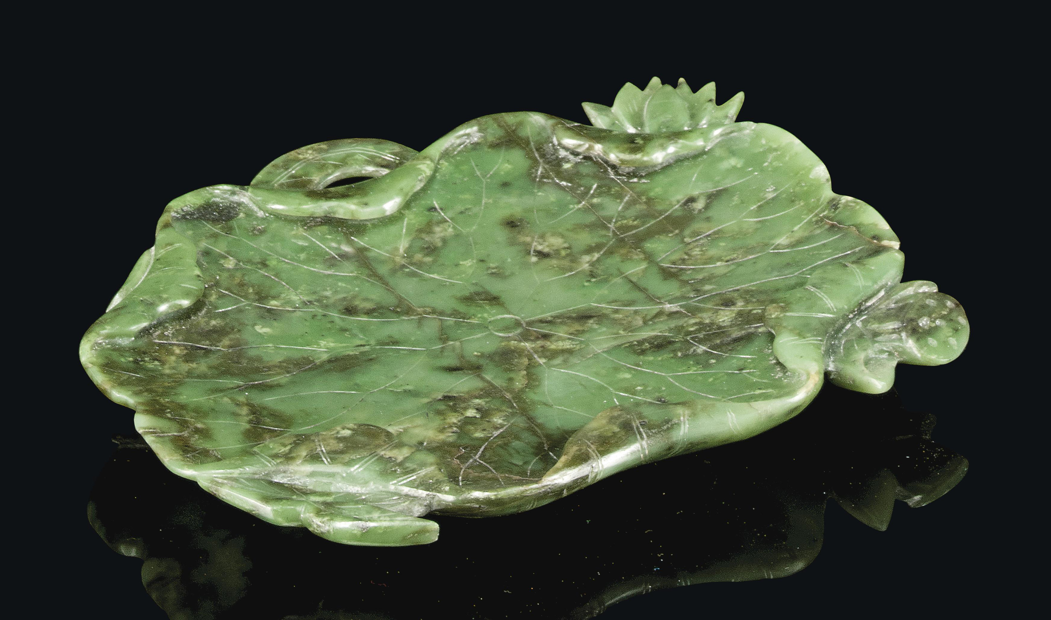A CHINESE SPINACH JADE LOTUS LEAF DISH