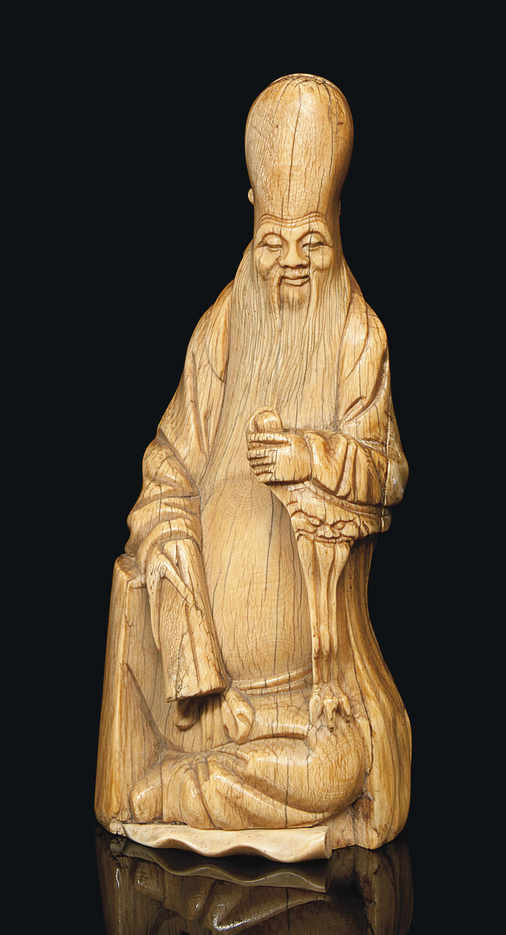 A CHINESE IVORY CARVED FIGURE OF SHOULAO , 17TH CENTURY Christie's